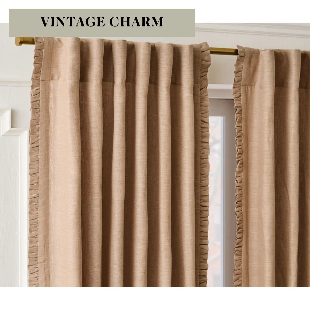 Warm tan curtain panels with delicate ruffled trim and gathered fabric hanging from a curtain rod.