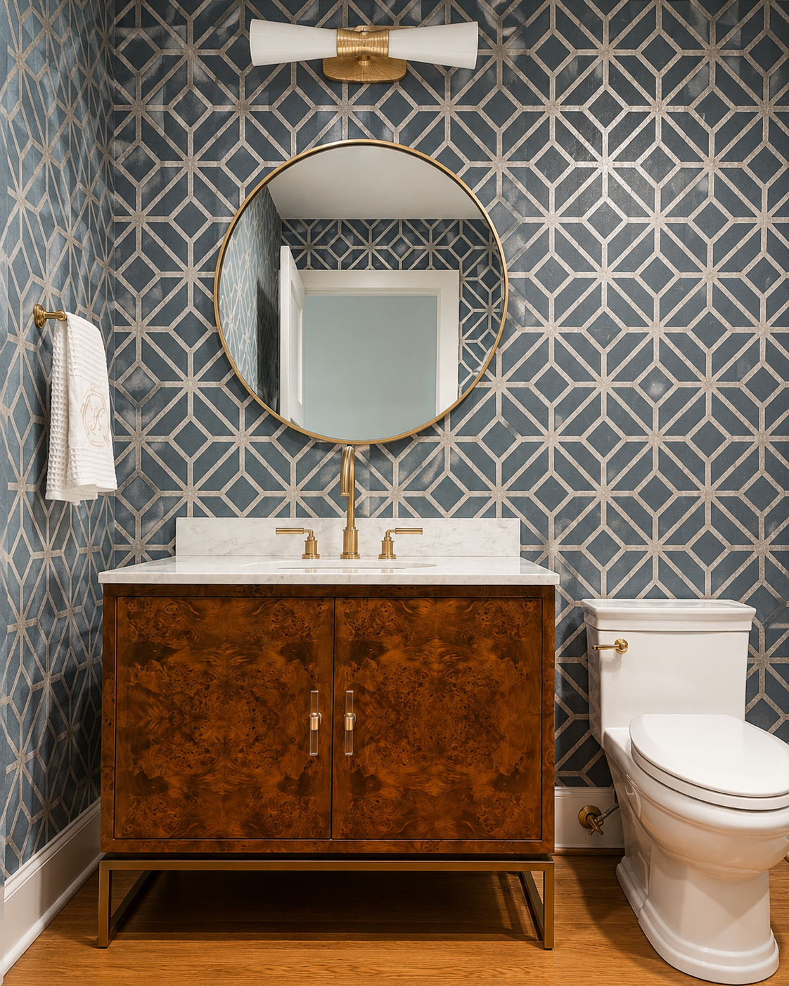powder room vanity with gold circle mirror and blue cork wallpaper