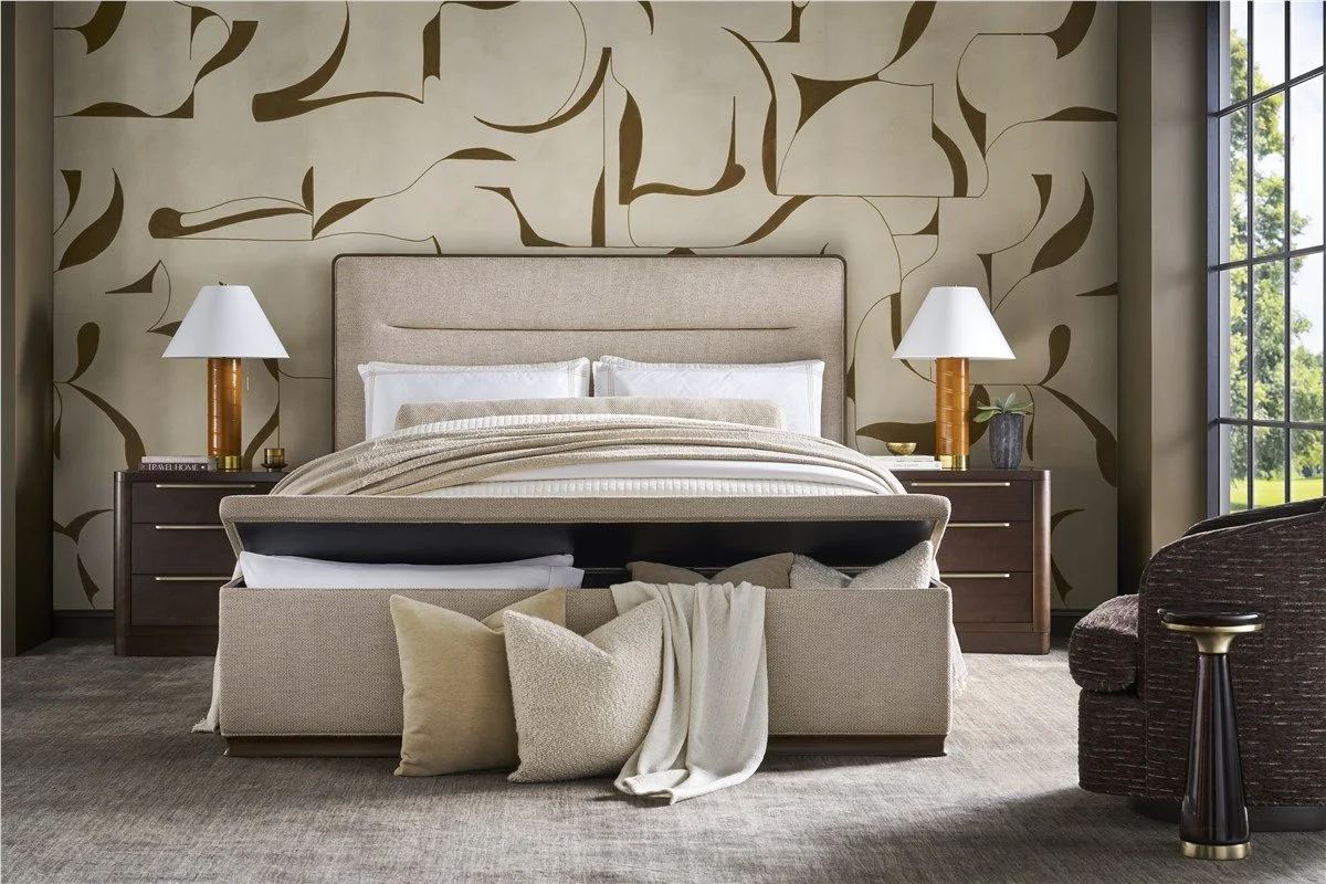 Neutral bedroom featuring layered bedding, soft textures, and upholstered headboard with storage bench