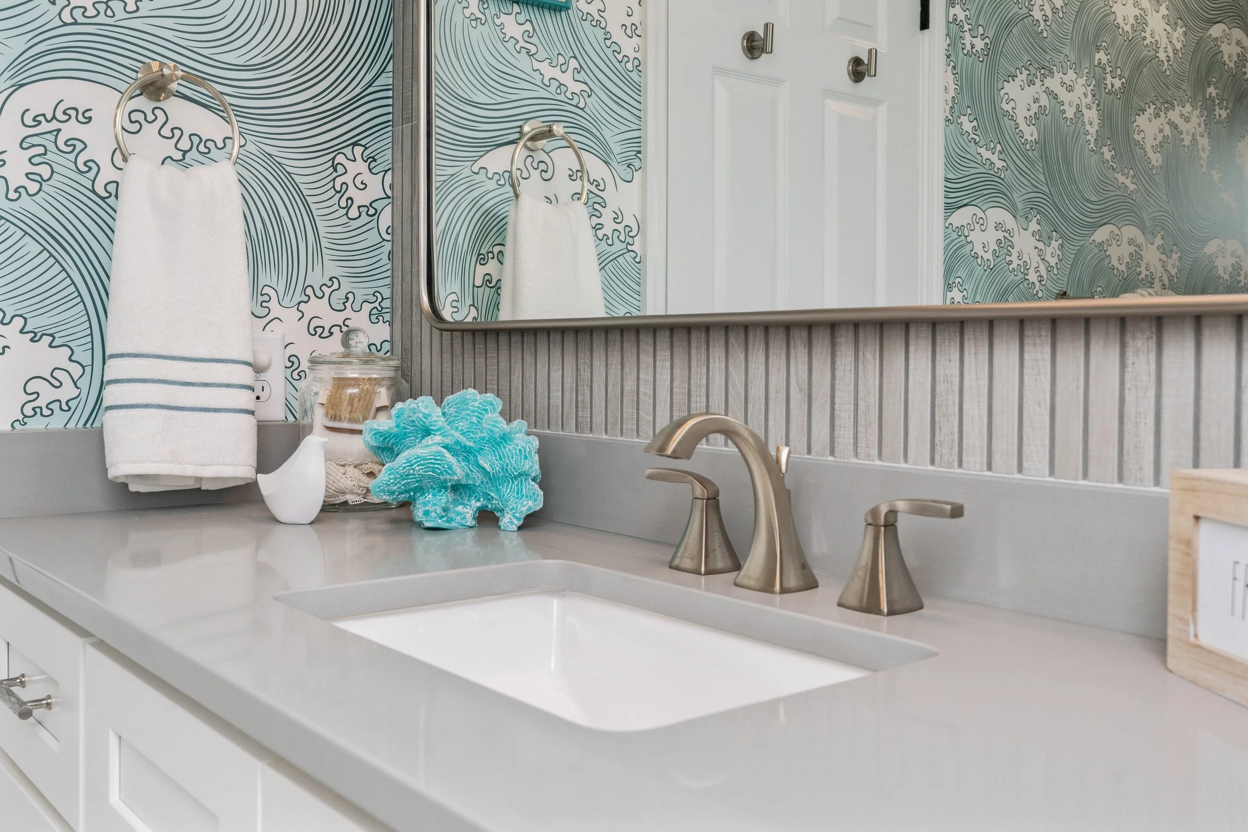 figure eight island nc custom bathroom design with ribbed fluted wall tile and coastal wave wallpaper