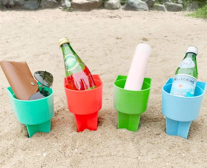beach cup holders in the sand