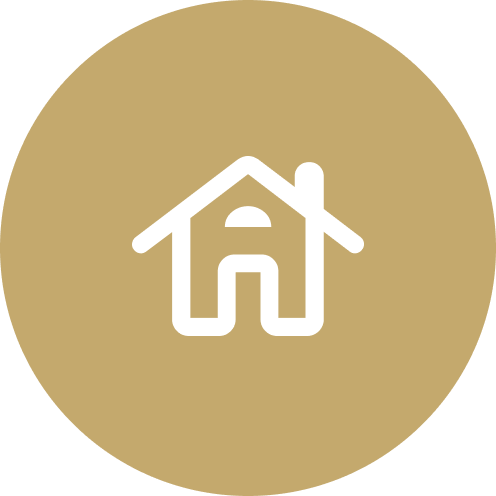 Icon of a house with a garage on a gold circular background.