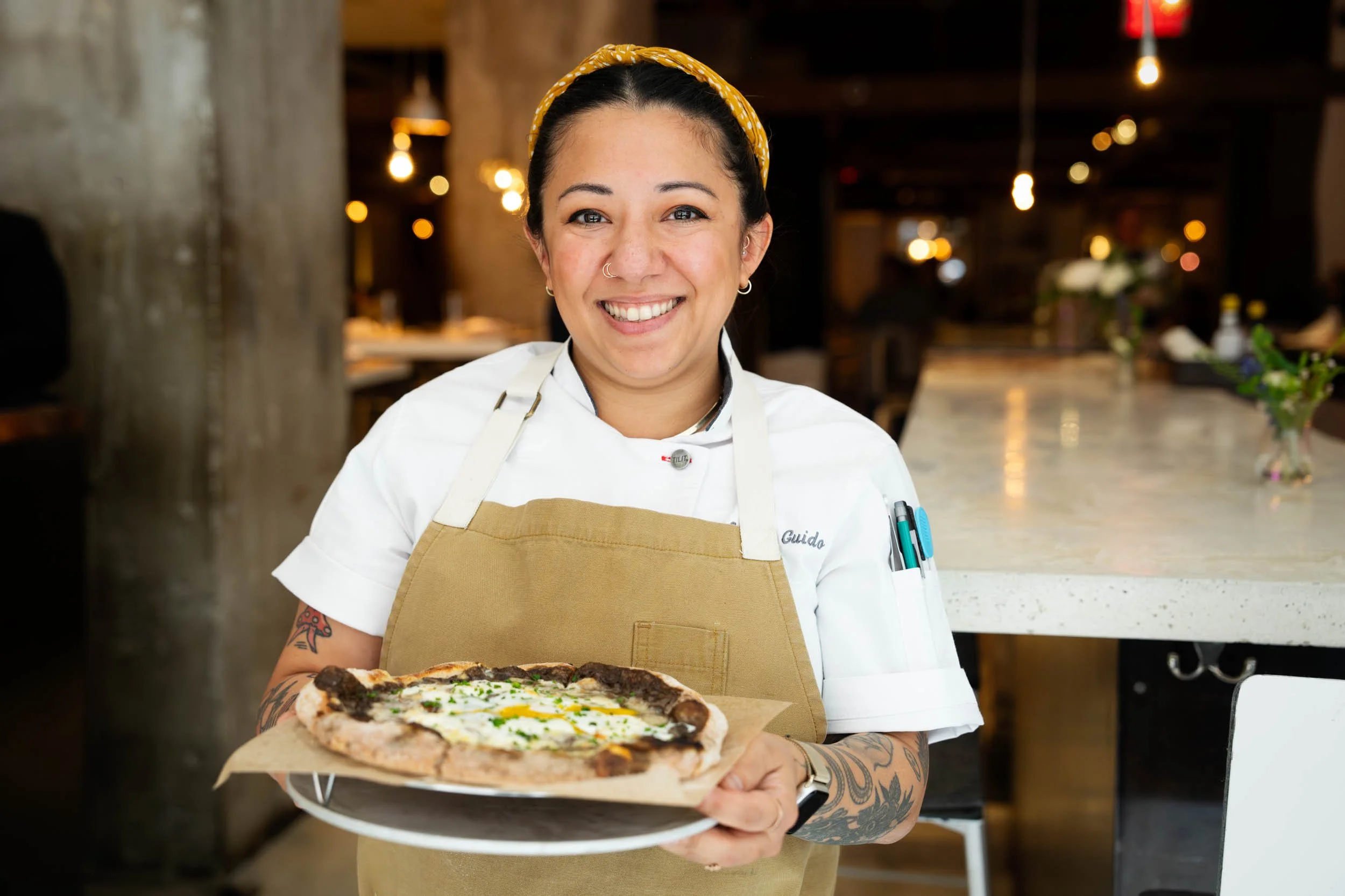 Female-Chef-with-Fresh-Pizza.jpg