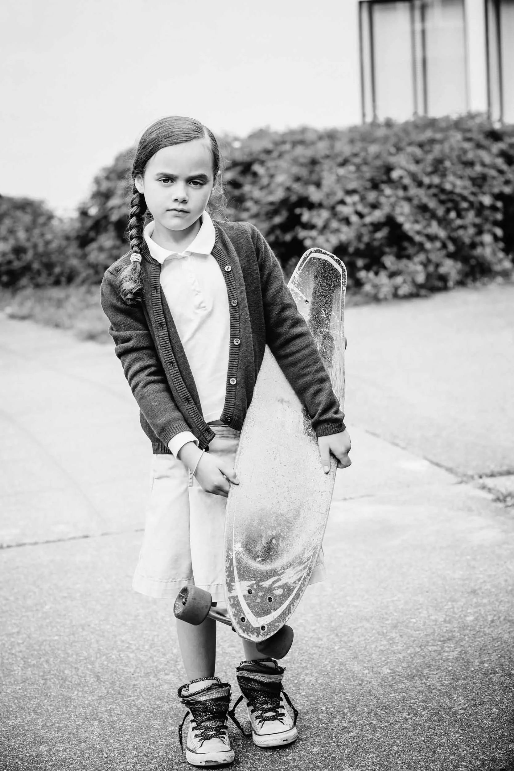 girl-school-uniform-holding-skateboard.jpg