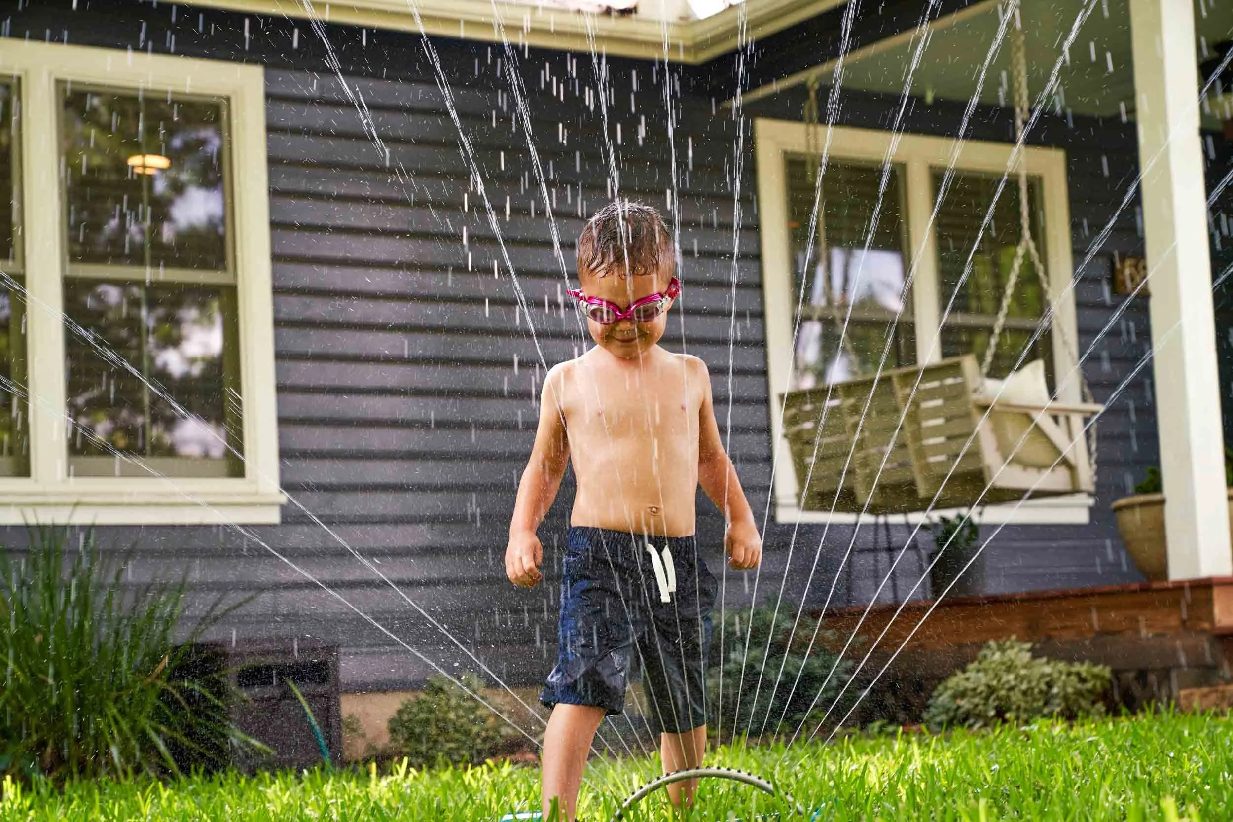 Boy-Having-Fun-in-Sprinkler.jpg