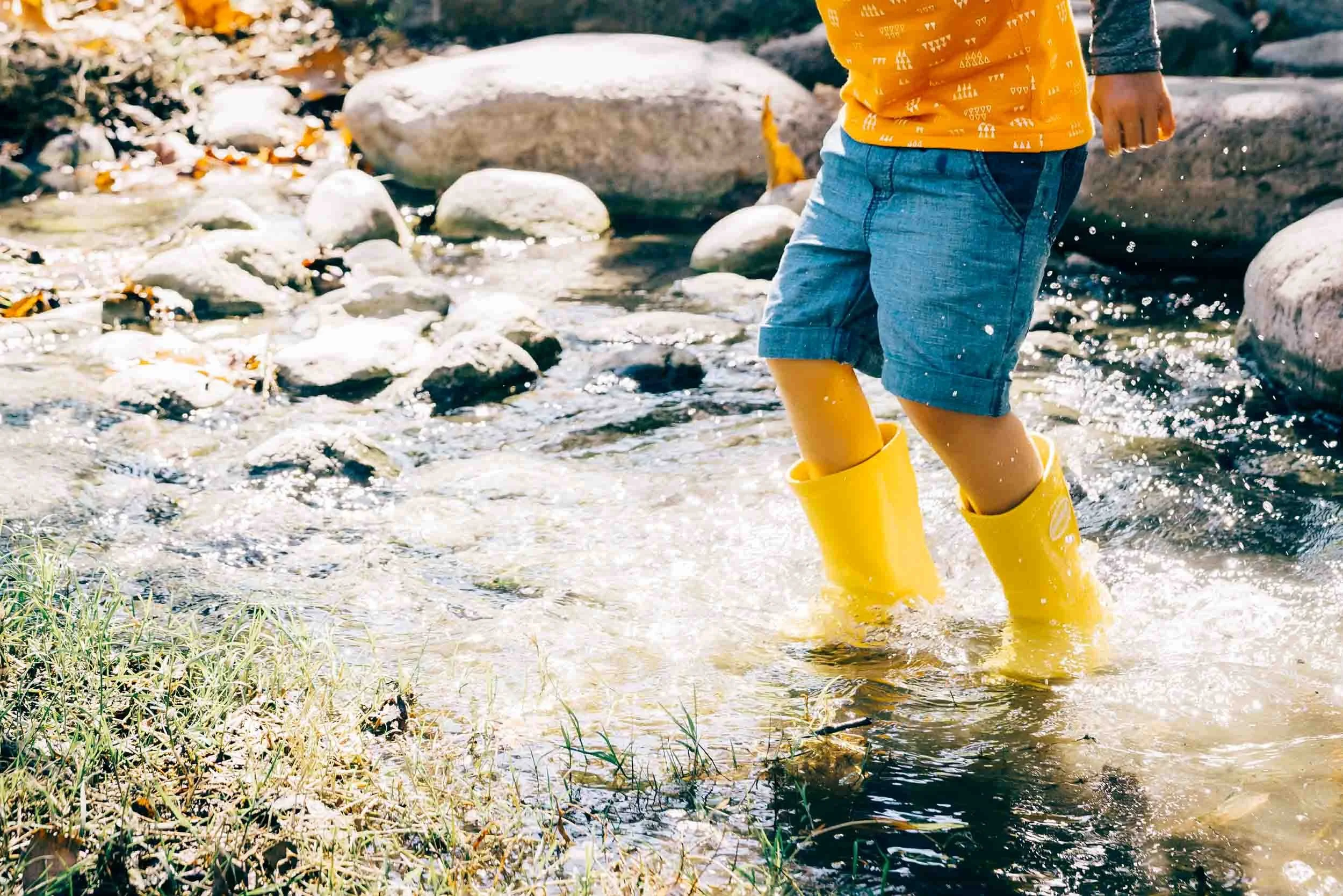 boy-jumping-in-creek-water.jpg