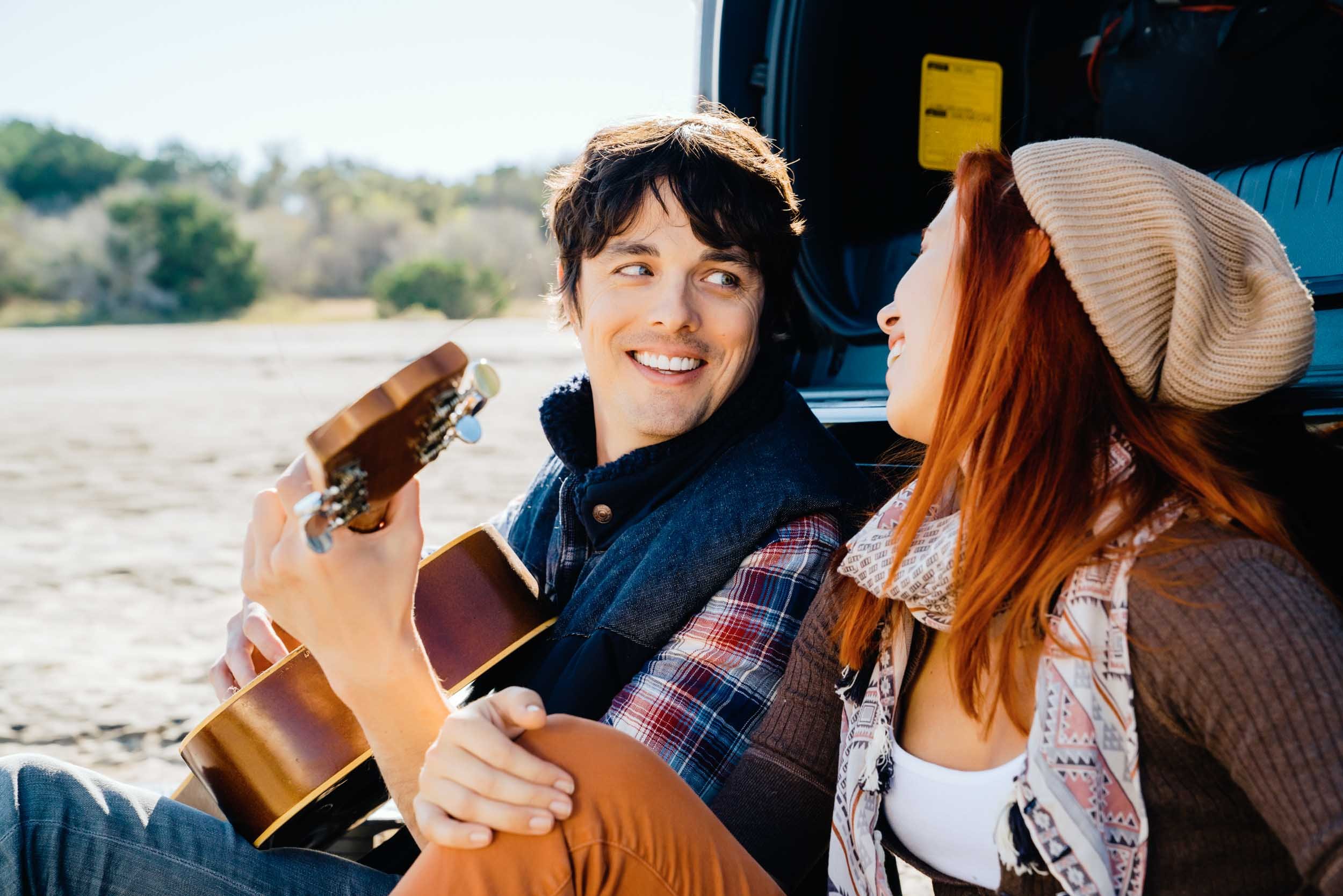 Couple-Playing-Guitar-by-Truck.jpg