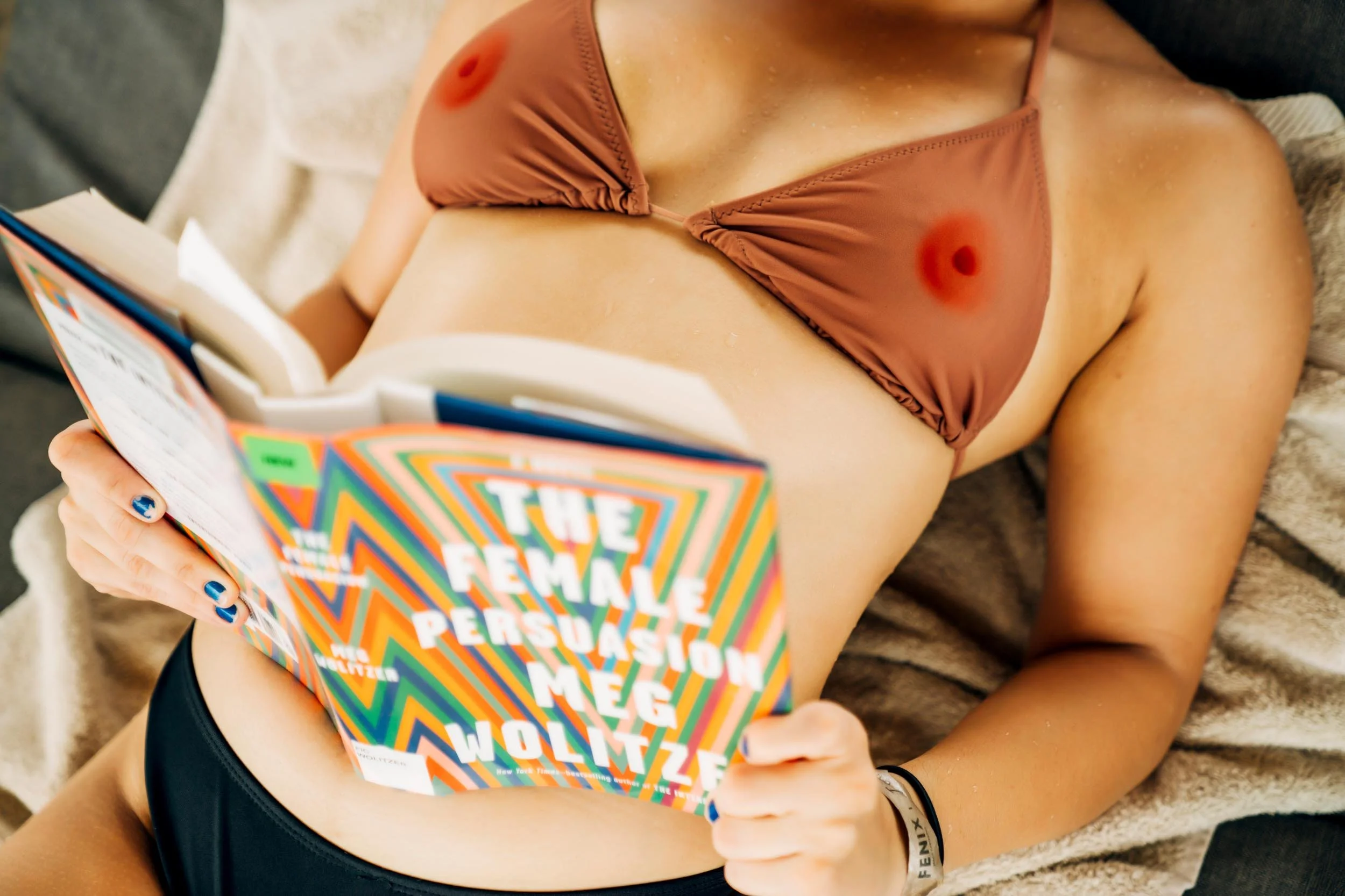 Woman-in-nipple-bikini-reading-book.jpg
