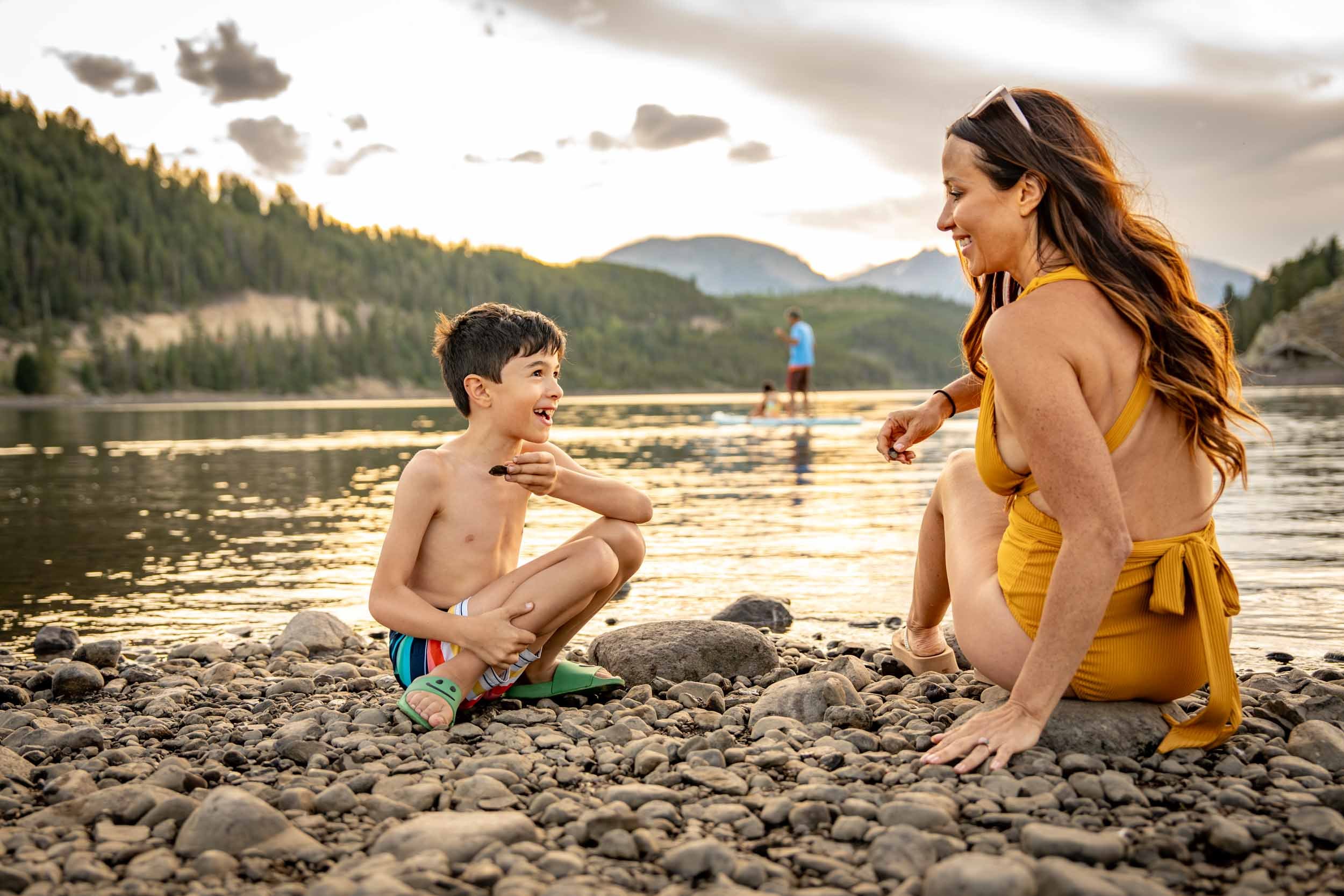 Woman-and-Child-Skipping-Rocks-on-Lake.jpg