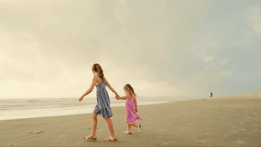 Girls-Holding-Hands-Walking-on-Beach.gif