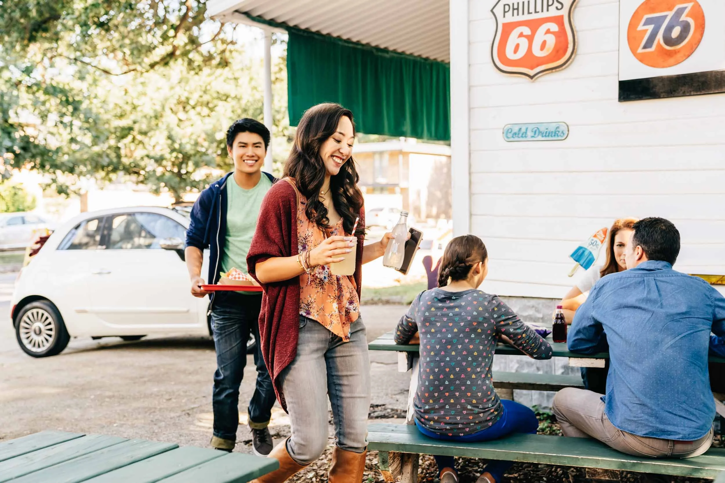 Couple-Walking-With-Food-Drink-Outside-Store.jpg