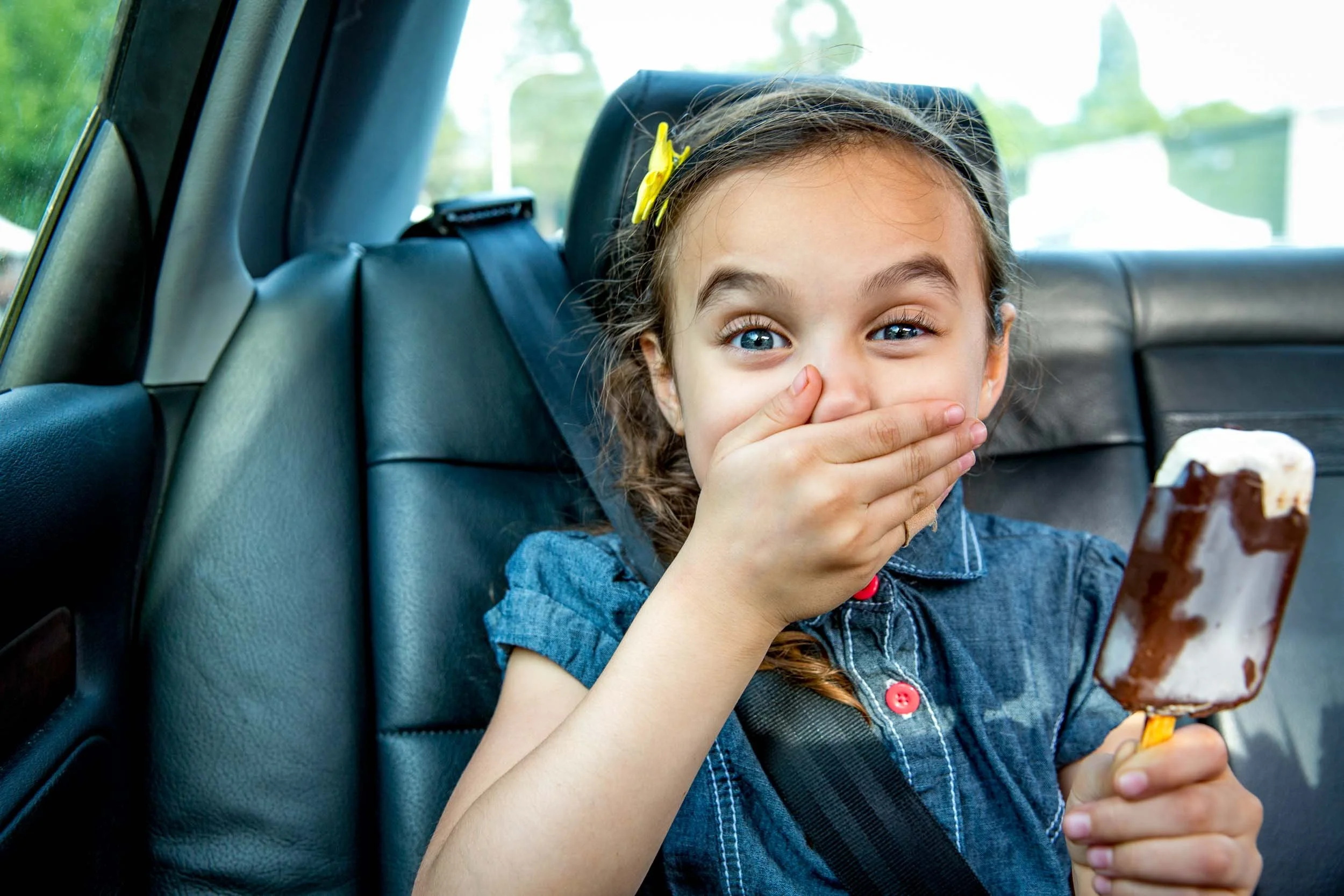 Girl-with-Popsicle-in-Car.jpg