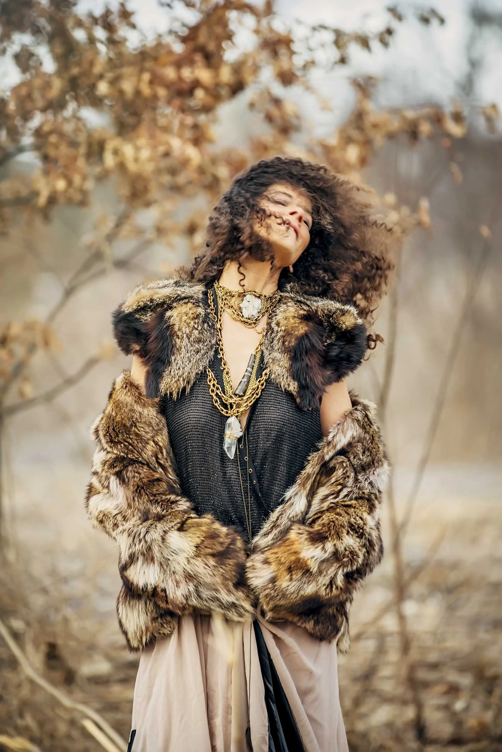 Woman-in-Fur-with-Crystal-and-Brass-Necklaces-in-Fall-Forest.JPG