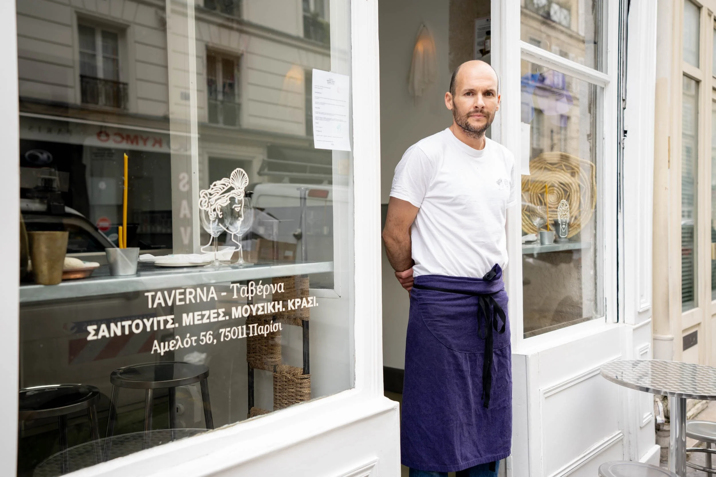 Man-in-Doorway-of-Taverna-Restaurant-in-Paris.jpg