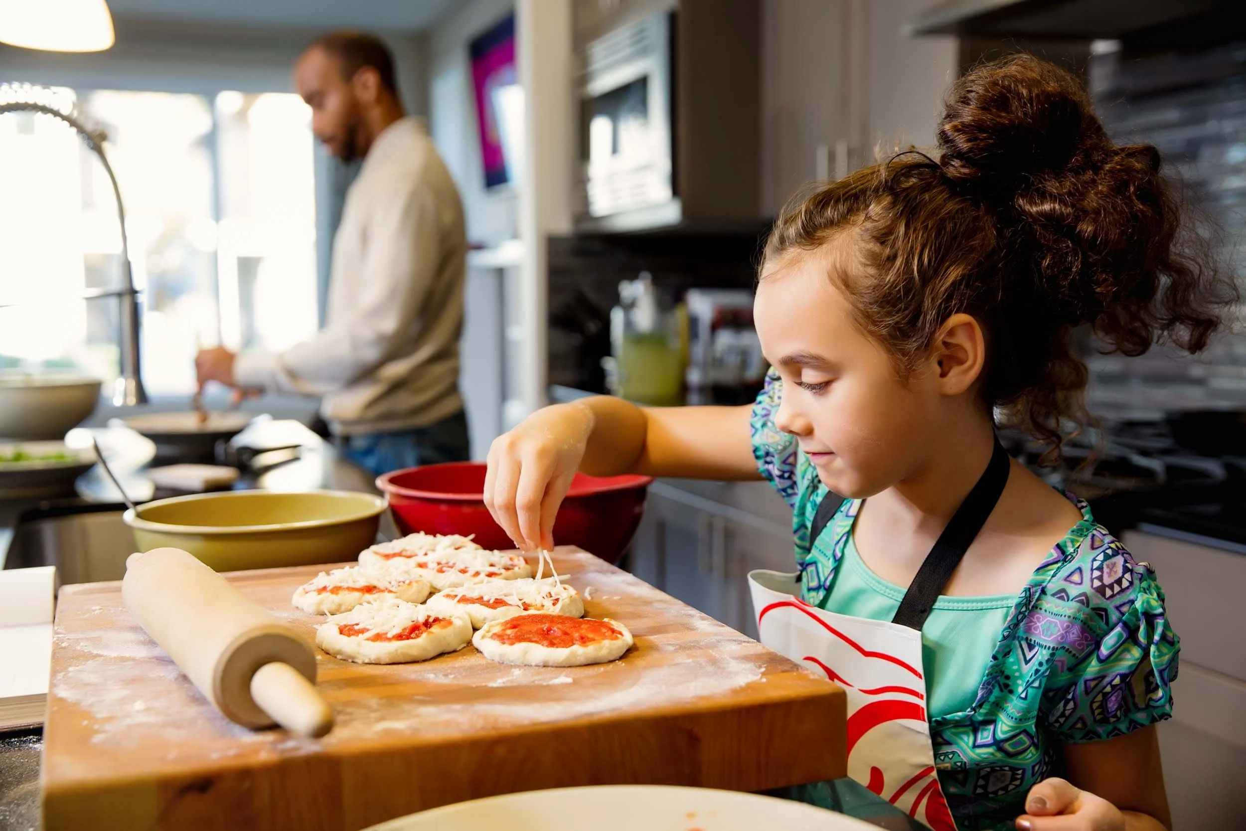 Family-Making-Pizza-in-Kitchen.jpg
