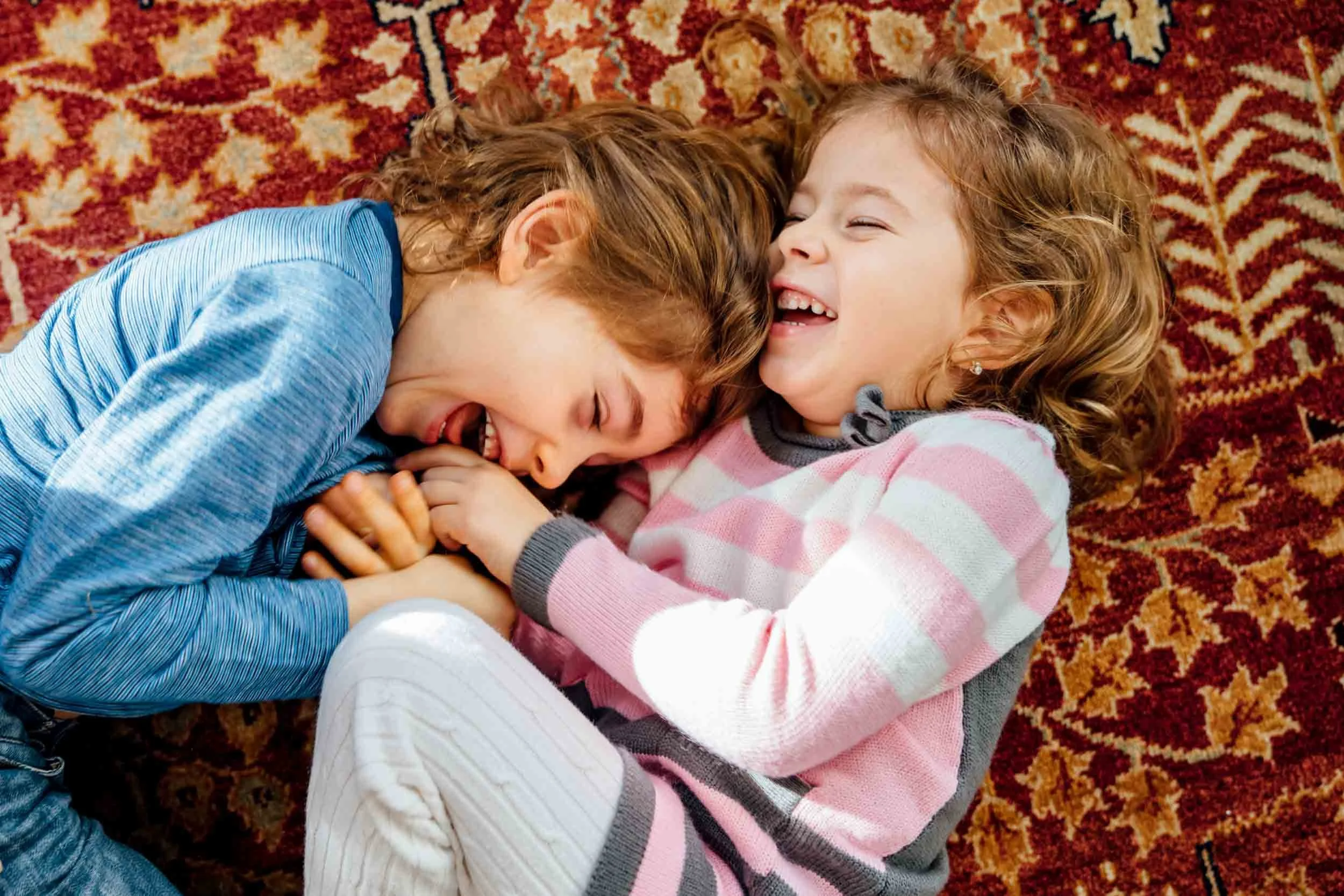 Laughing-Children-on-Carpet.jpg