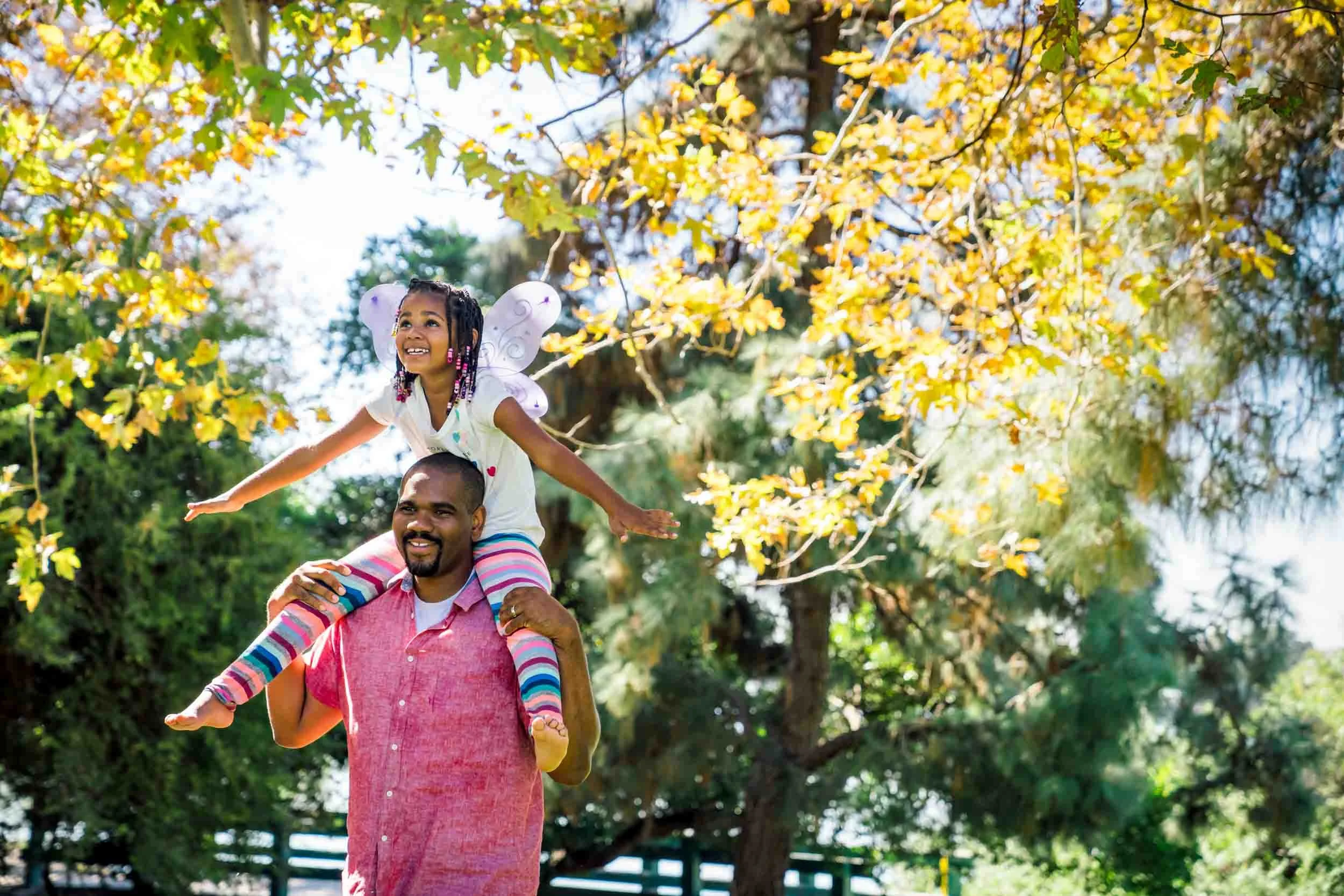 Girl-riding-on-dads-shoulders.jpg