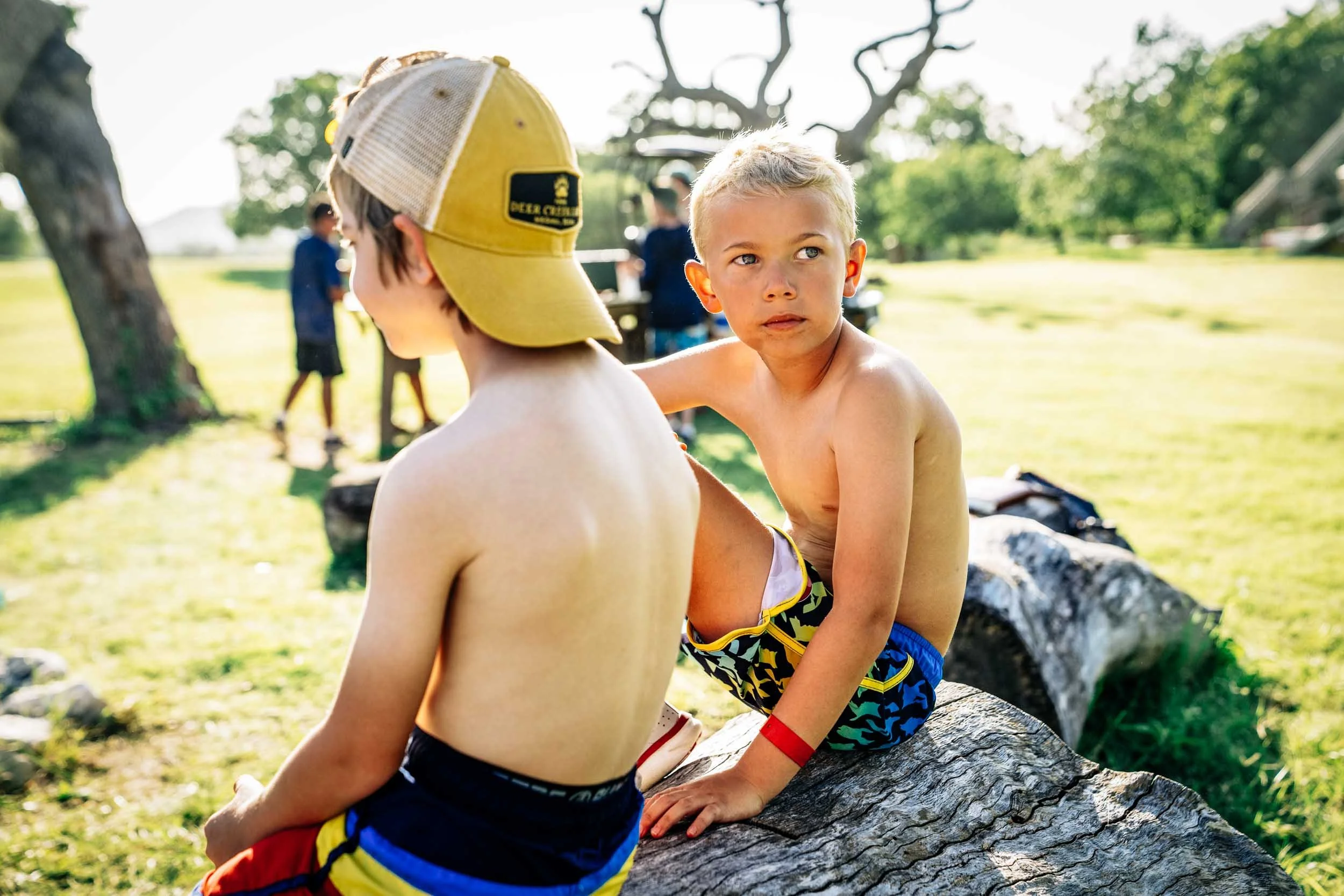 Boys-Sitting-on-Log.jpg