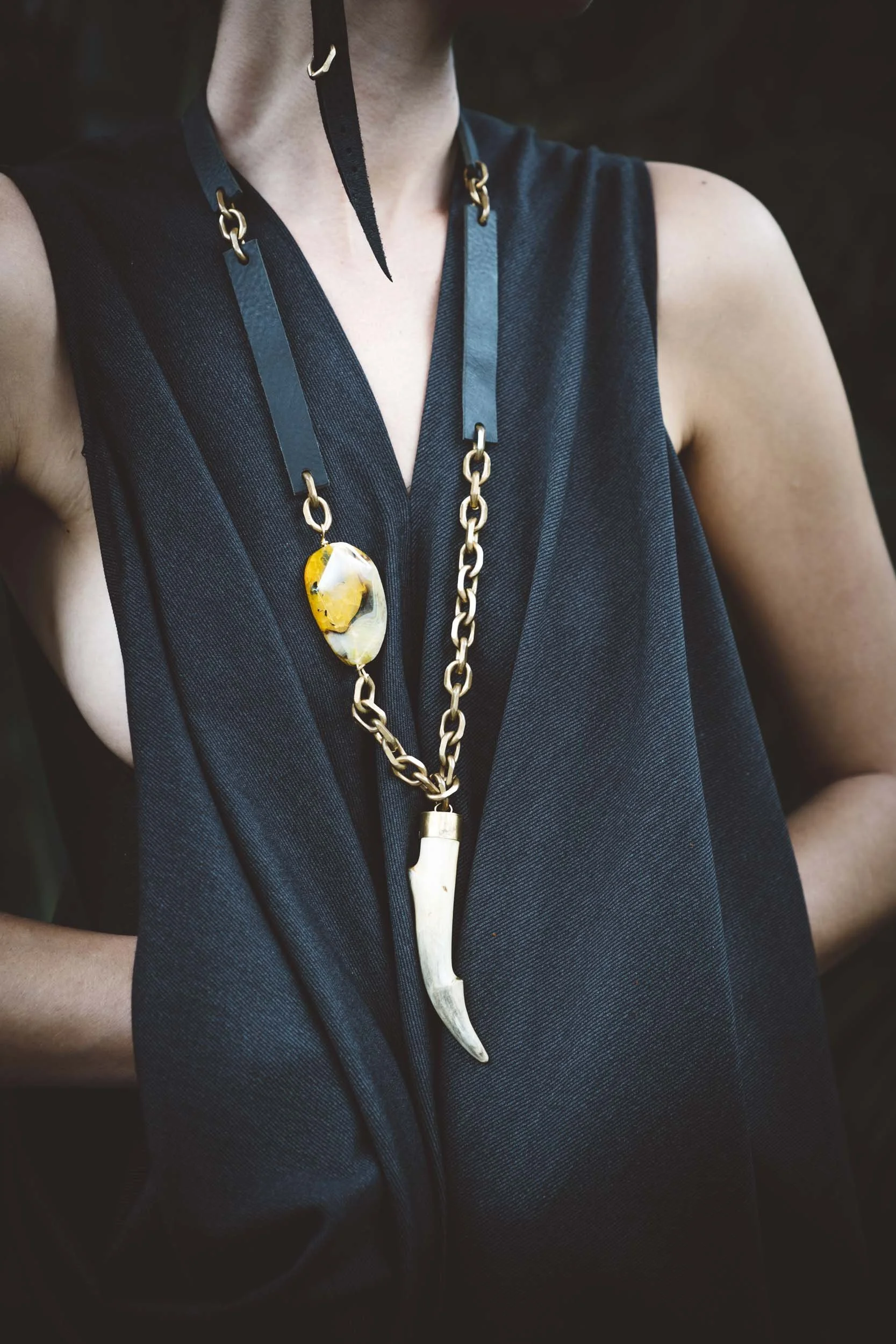 Woman-wearing-black-leather-brass-bone-and-stone-necklacejpg.JPG