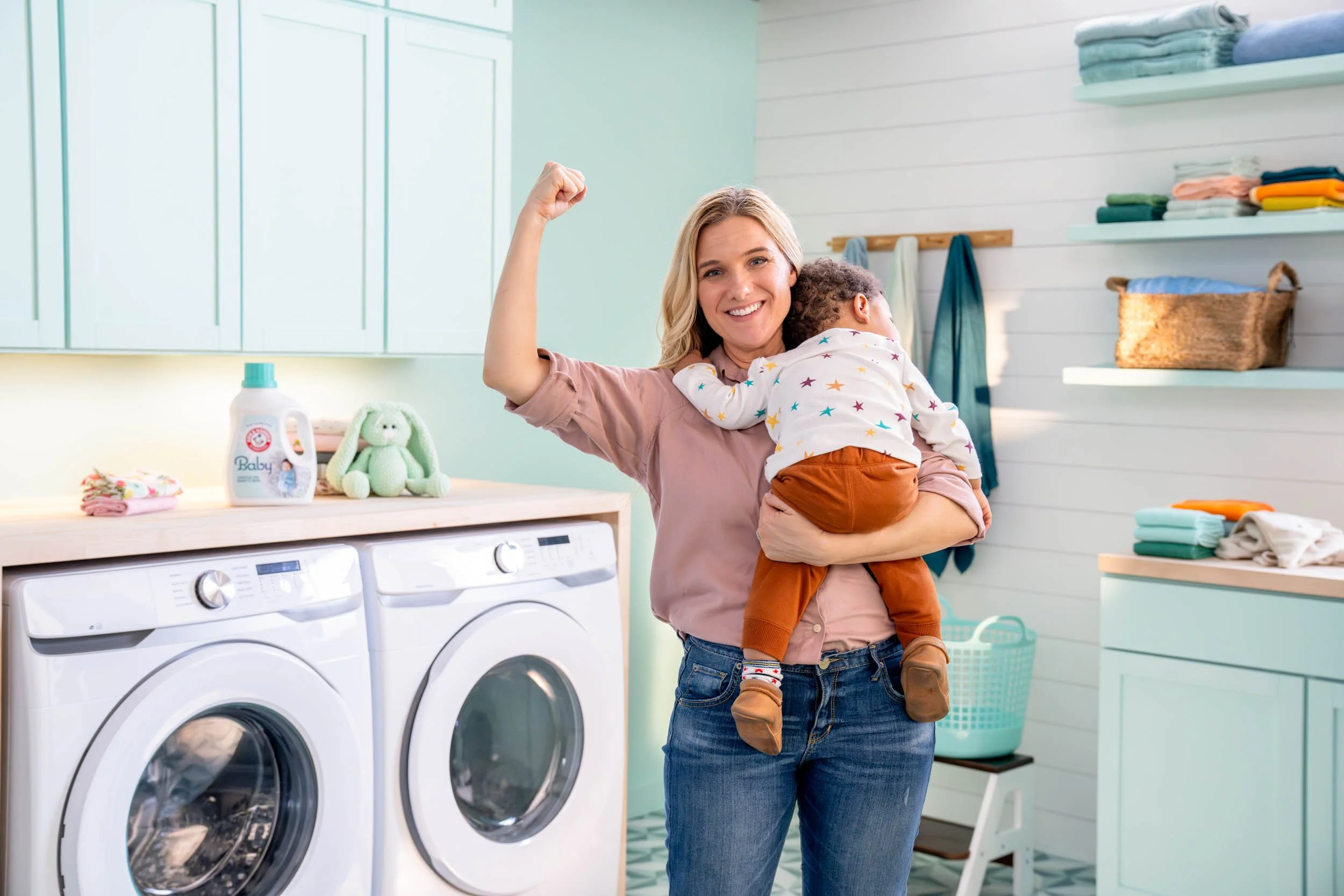 Woman-Holding-Baby-in-Laundry-Room.jpg
