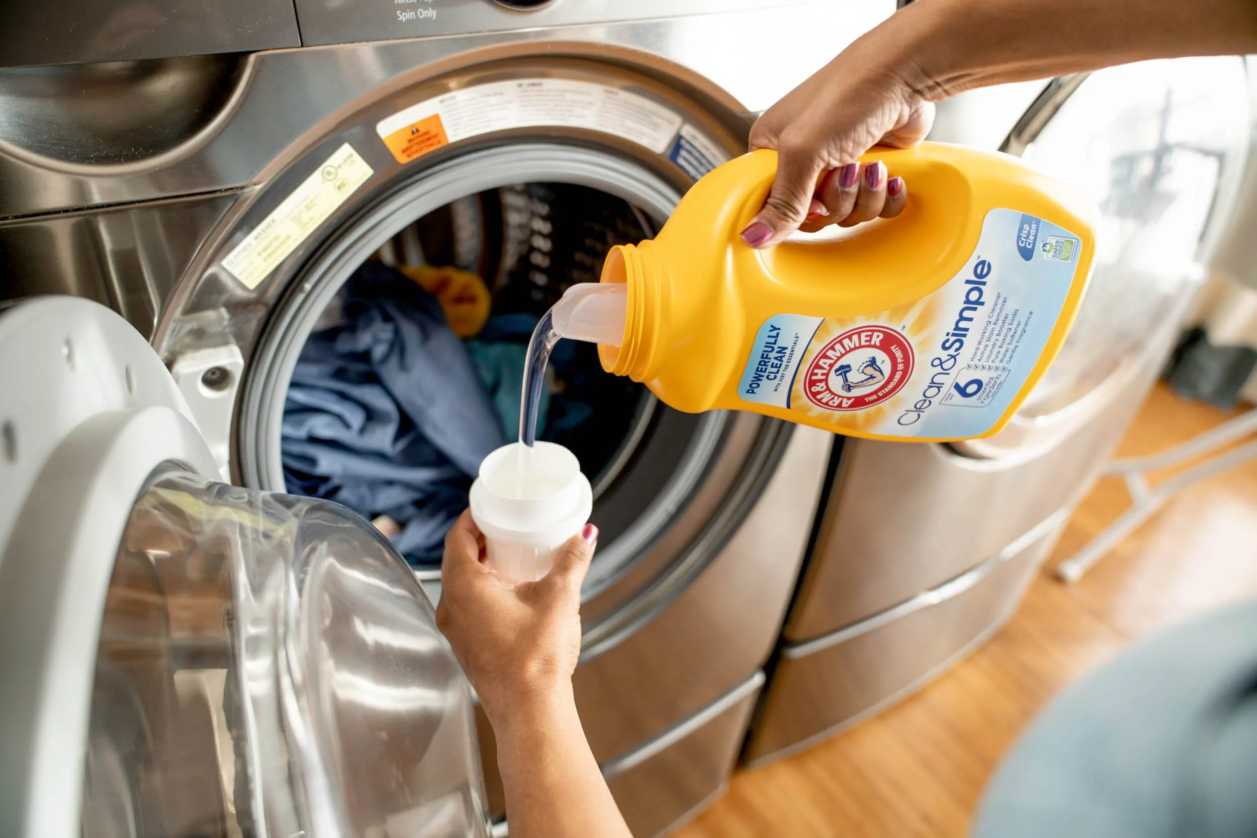 Woman-pouring-laundry-detergent.jpg
