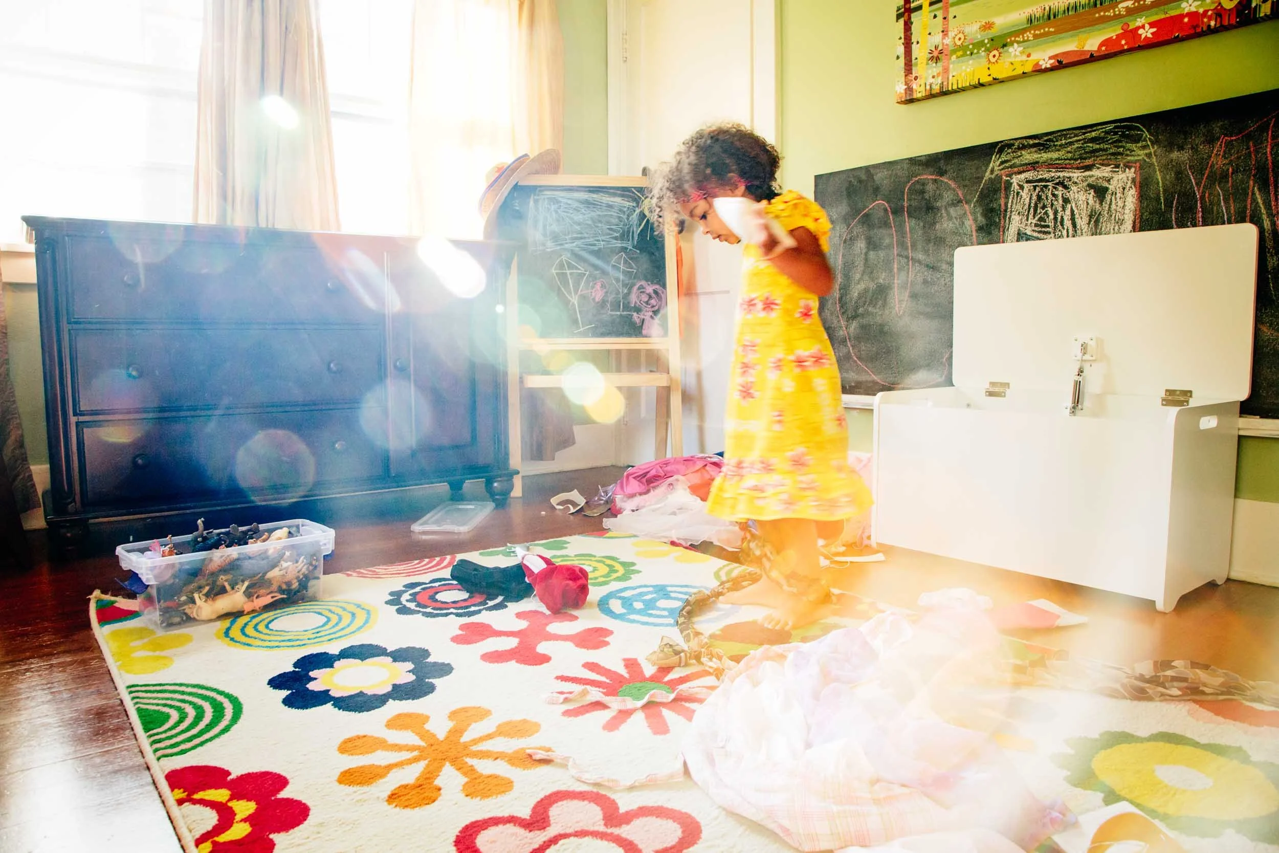 Child-Playing-Indoors-in-Sunlit-Room.jpg