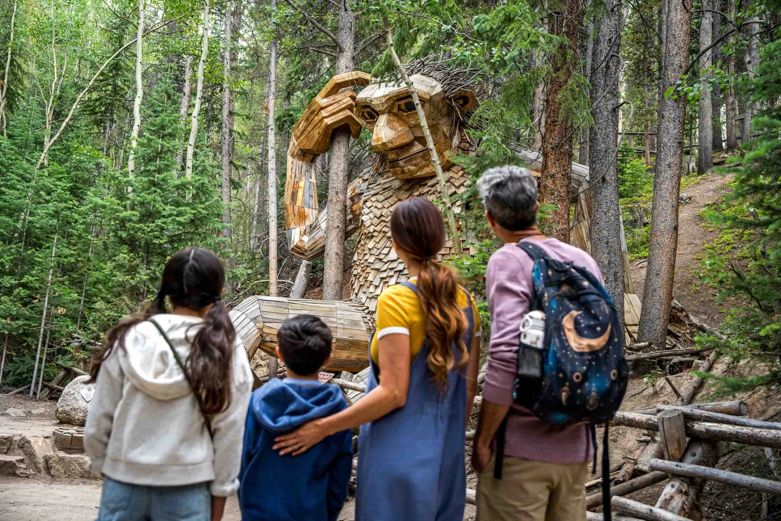 Family-Observes-Wooden-Troll.jpg