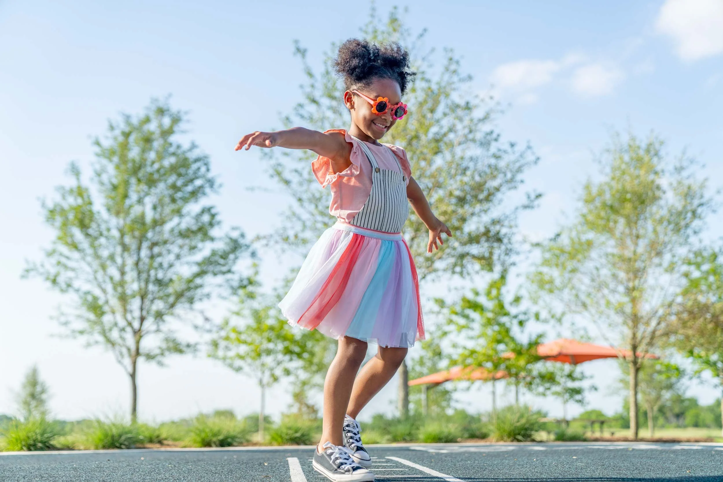 Girl-Twirling-at-Park.jpg