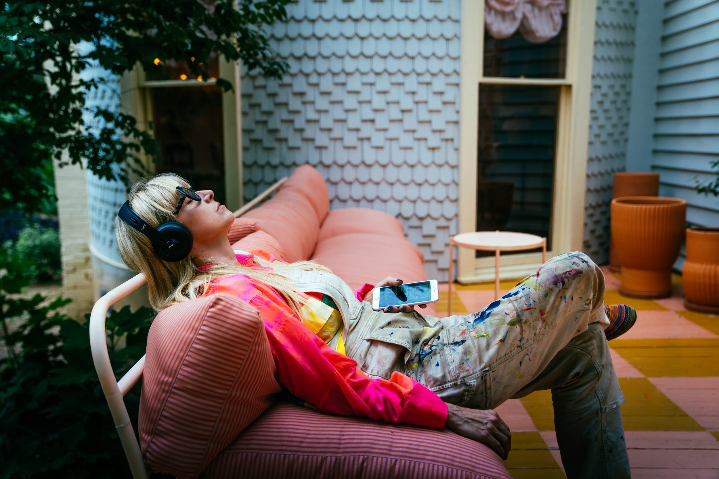 Woman-Relaxing-on-Patio-with-Headphones.jpg