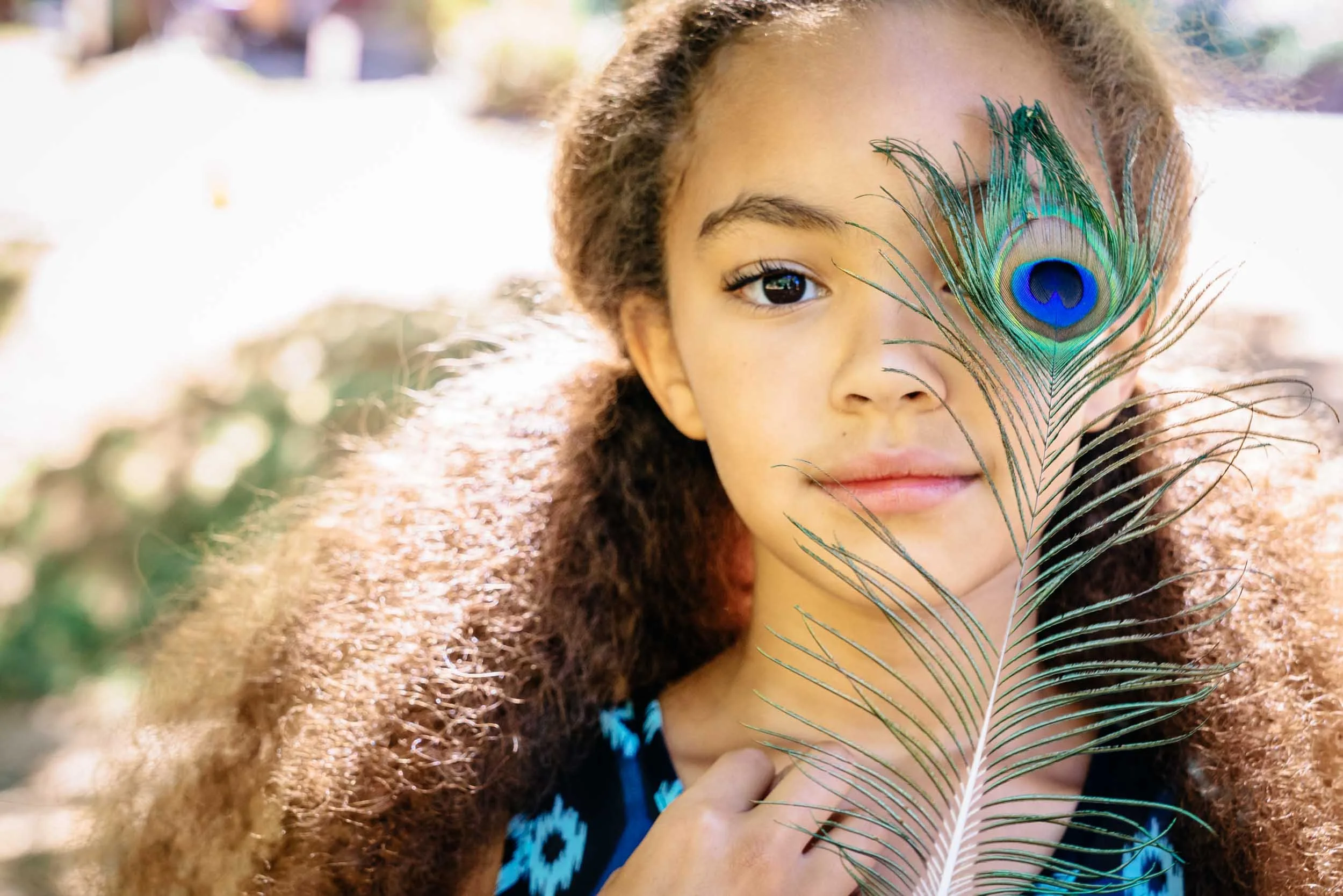 Girl-with-Peacock-Feather.jpg