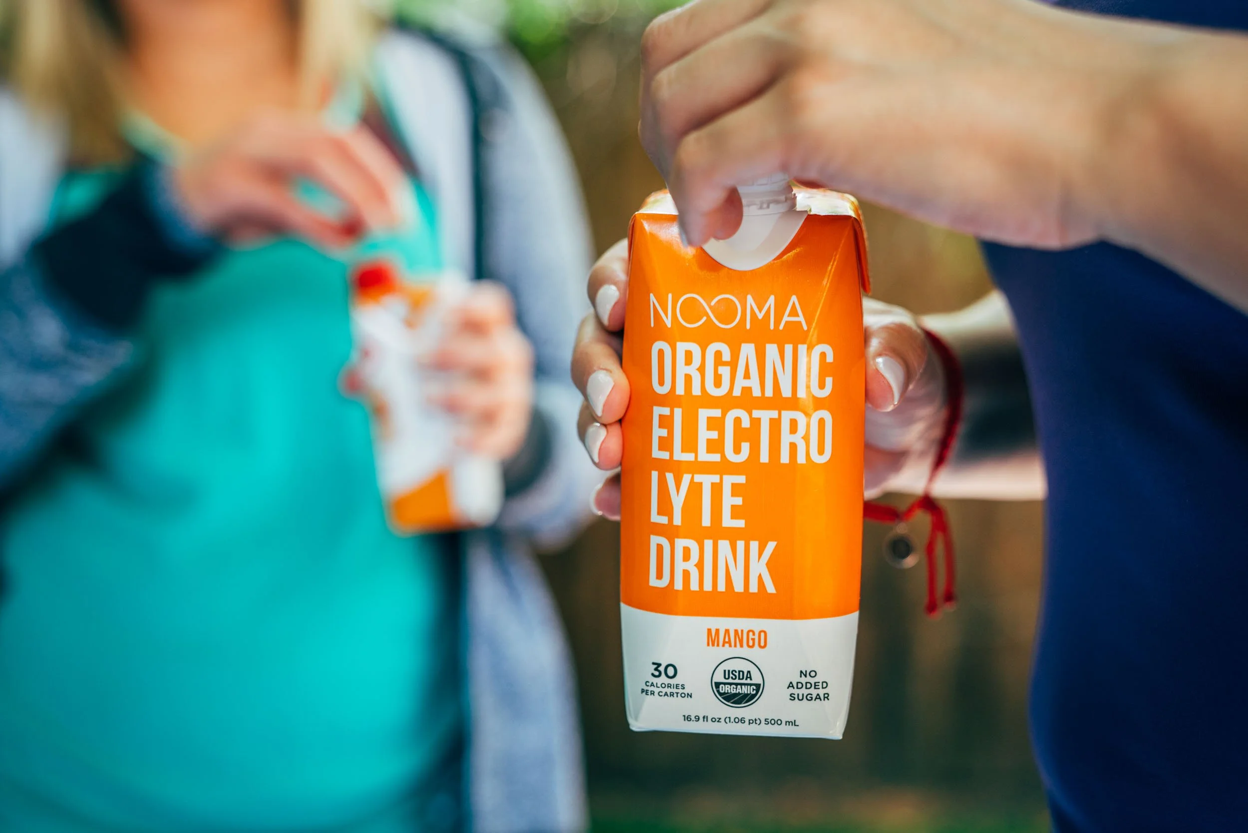 Nooma-Electrolyte-Drink-in-Hands.jpg