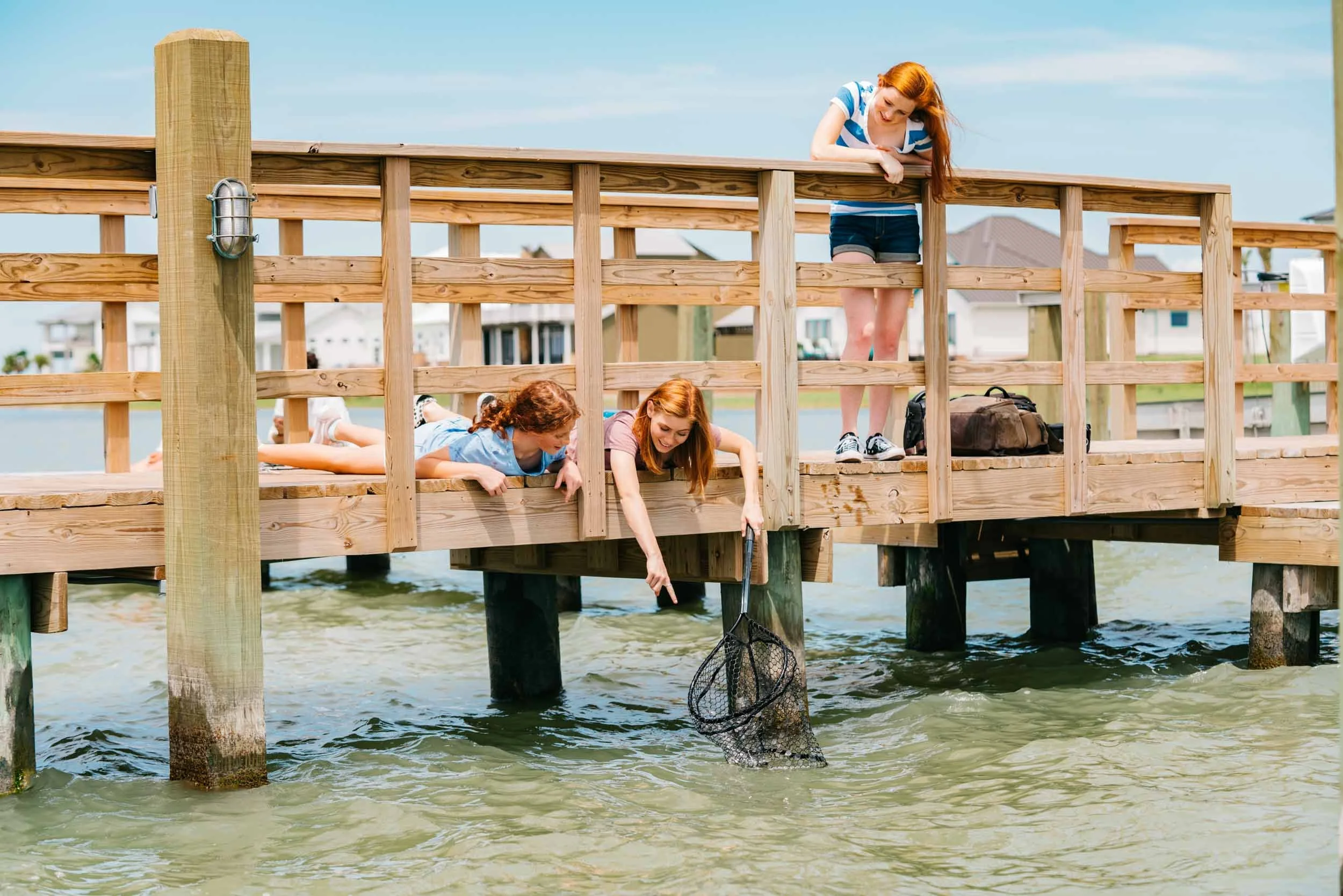 Girls-fishing-from-dock-with-Net.jpg