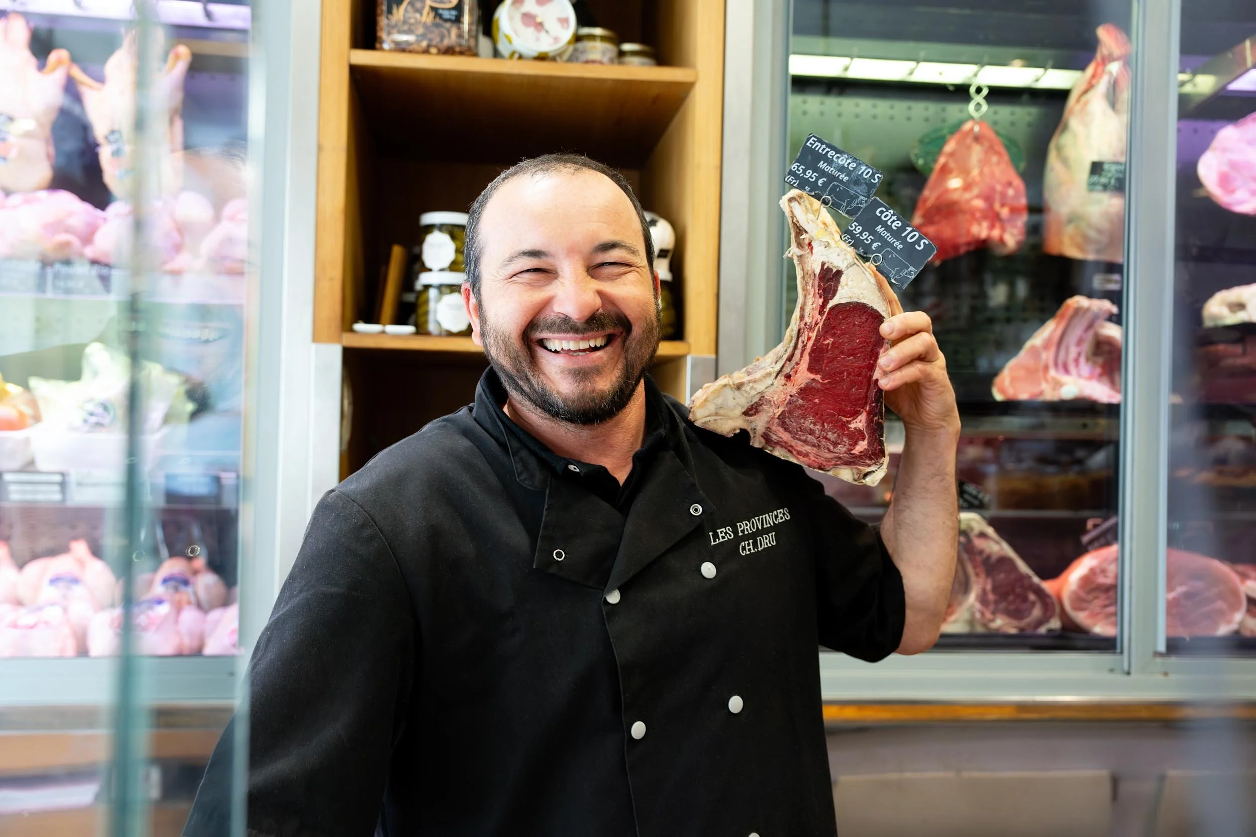 Smiling-Butcher-Holding-Meat.jpg