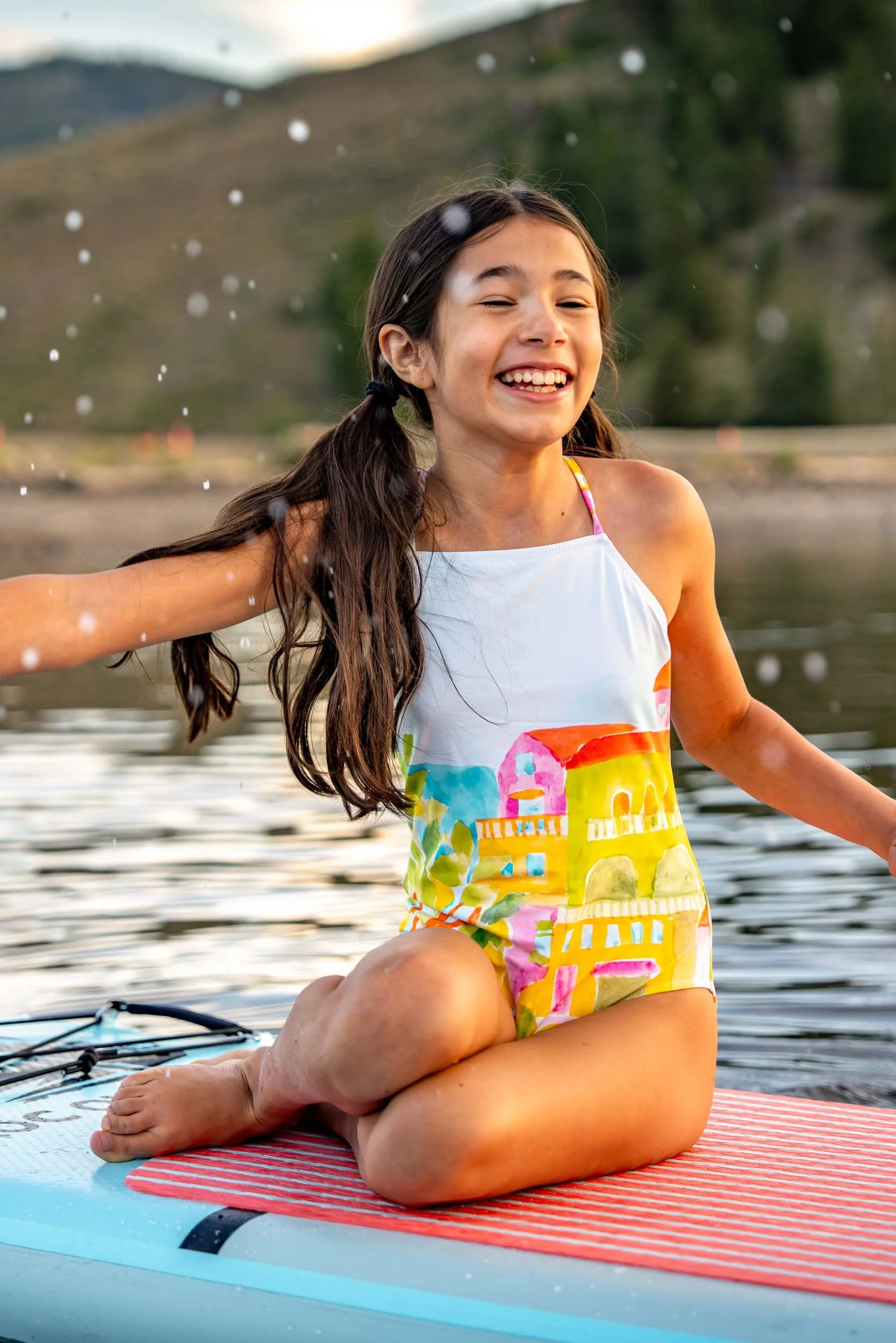 Girl-on-Paddleboard-Splashing-Water.jpg