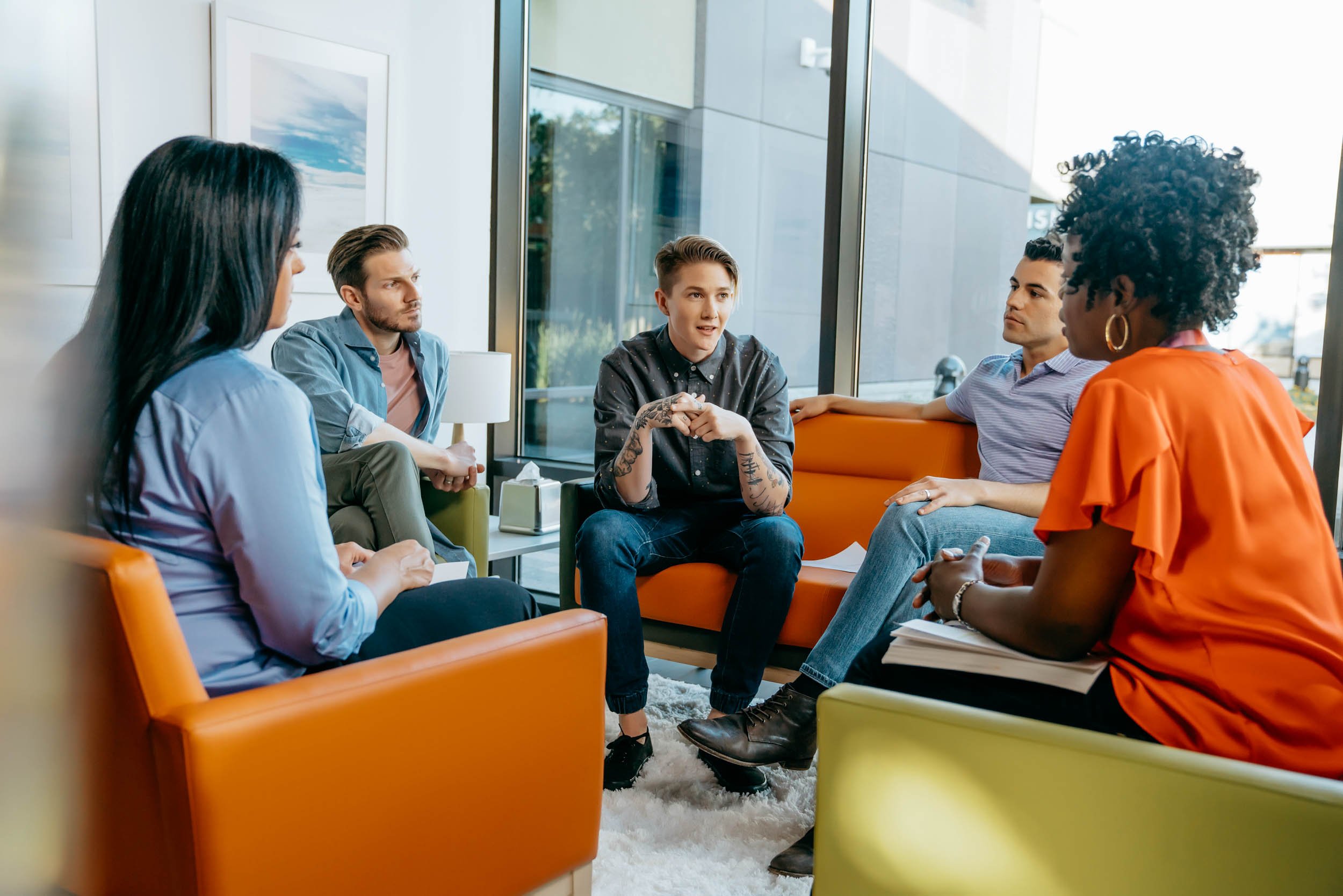 Transgender-man-talking-in-group-therapy-session.jpg
