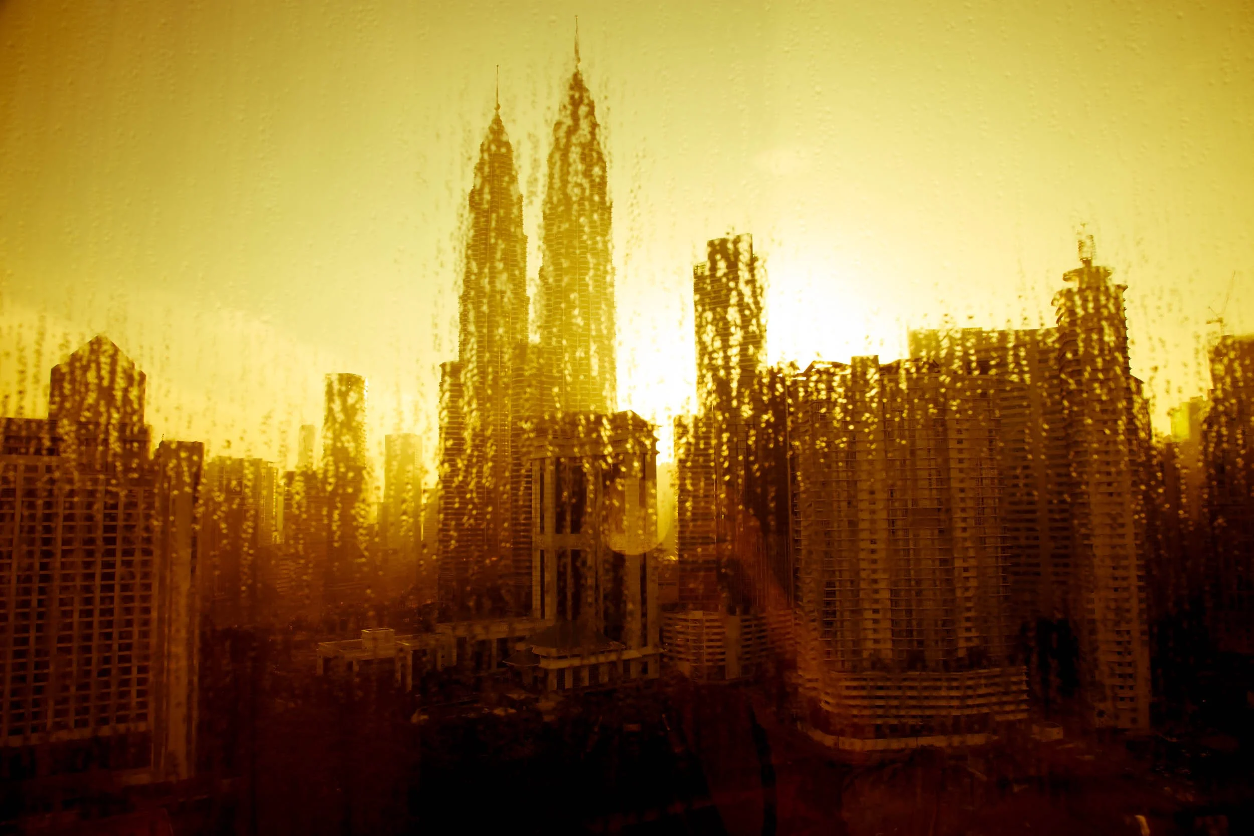 Kuala-Lumpur-Skyline-at-Sunrise-Through-Rain.jpg