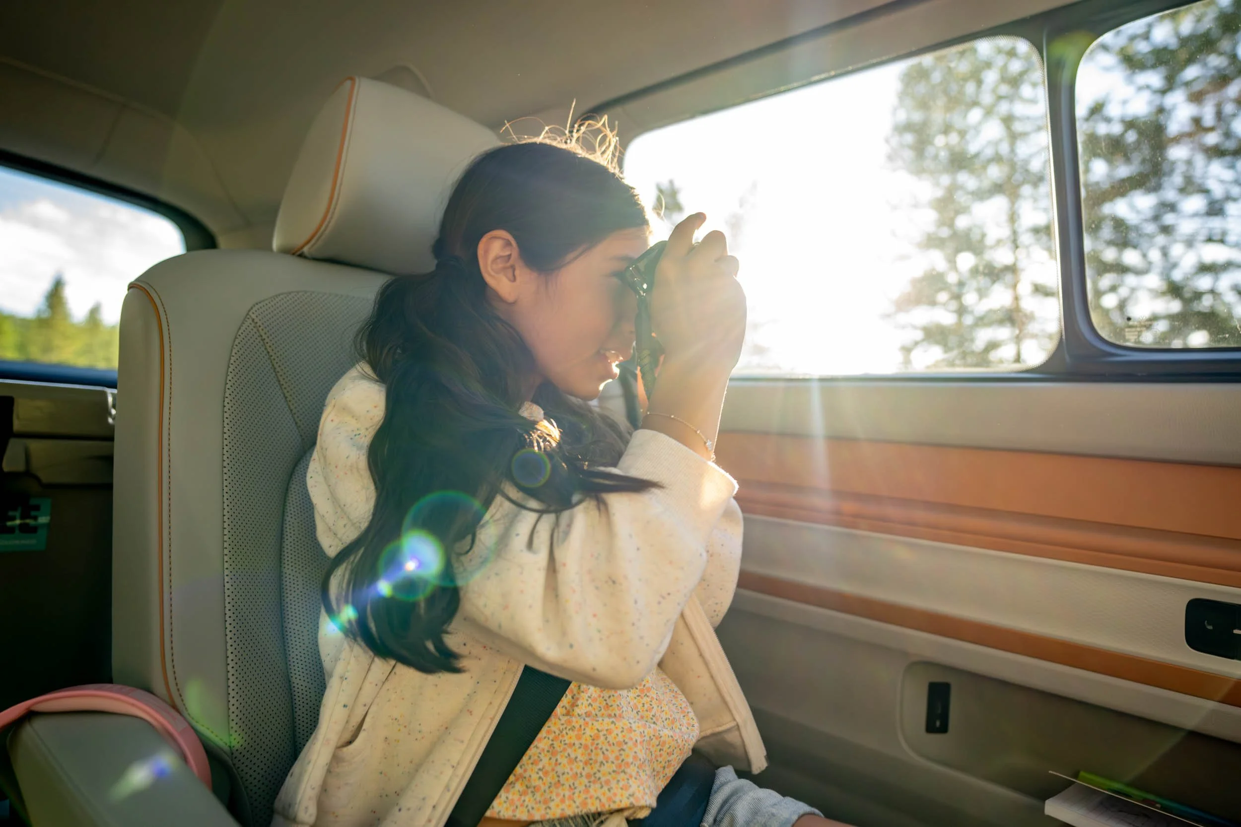 Girl-Taking-Photo-Through-Car-Window.jpg