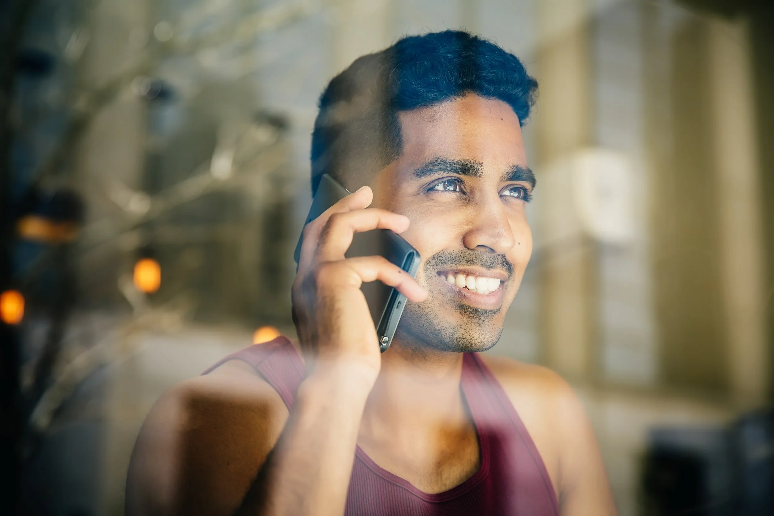 Man-Talking-on-Phone-Through-Window.jpg