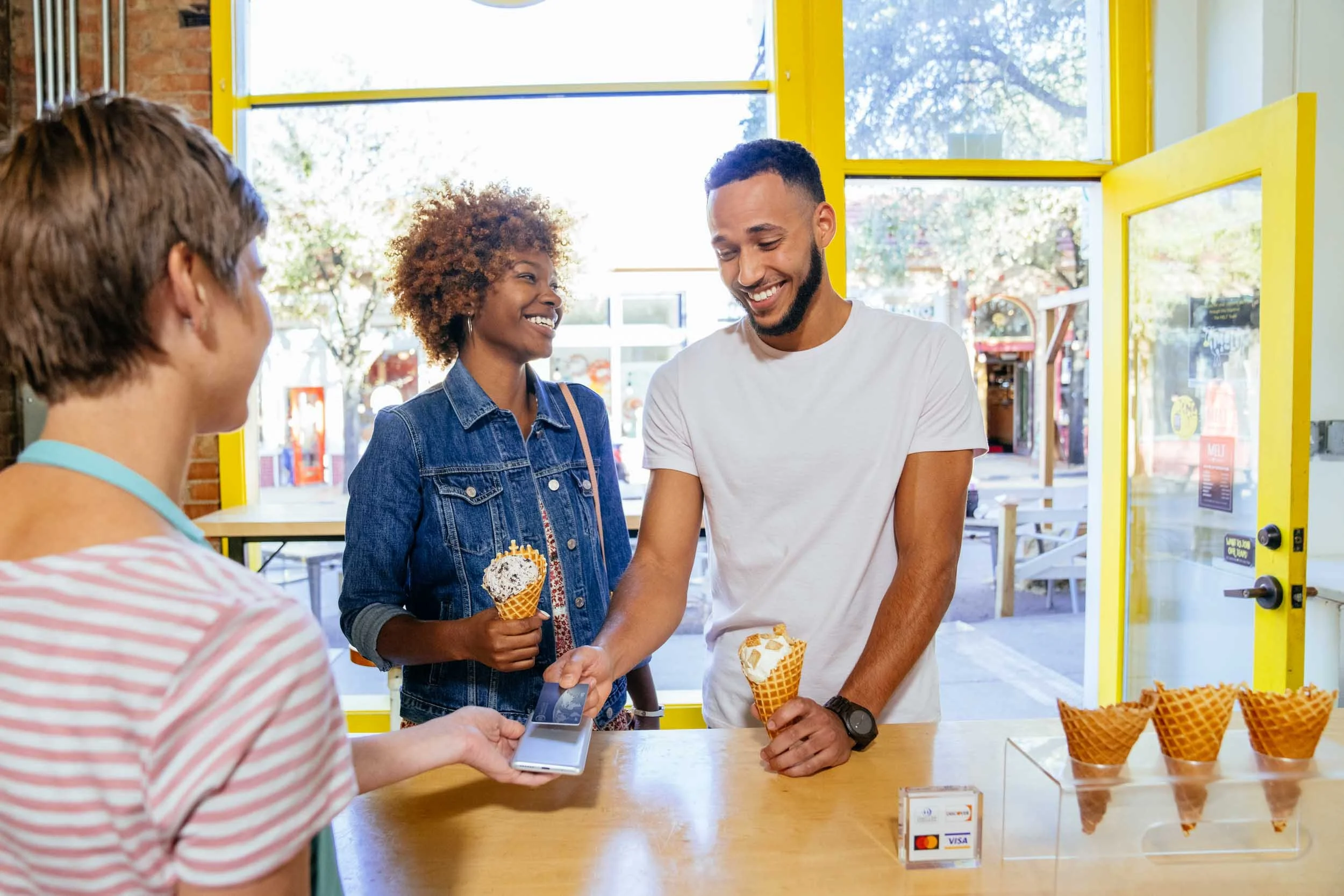 Paying-for-Ice-Cream-with-Card-Tapping-Phone.jpg