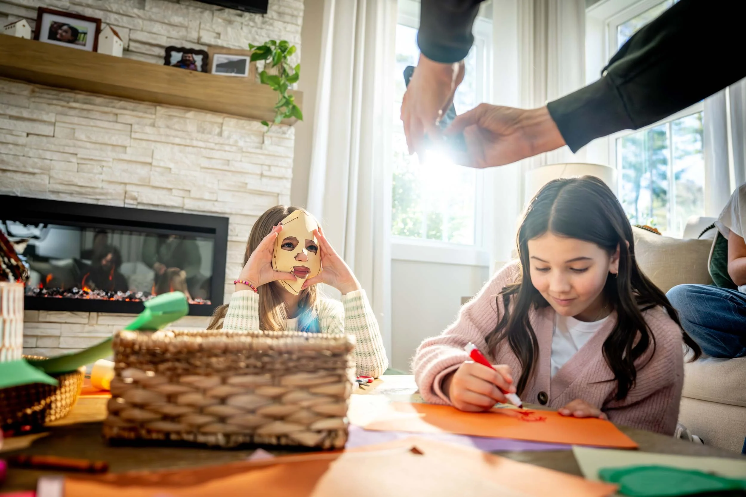 Man-Taking-Photo-of-Girls-Crafting.jpg