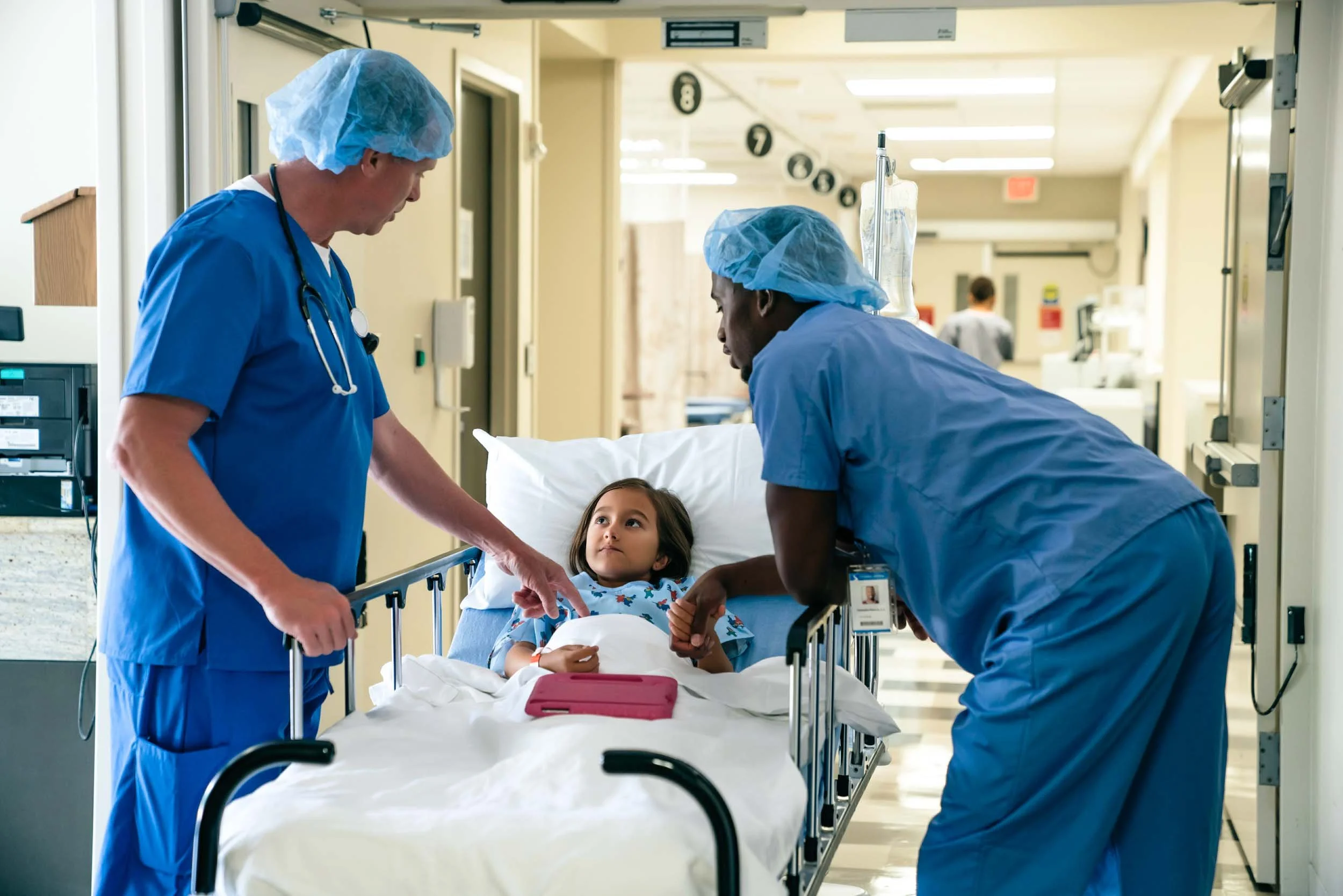 Surgeons-Talking-to-Child-Patient-in-Hospital.jpg