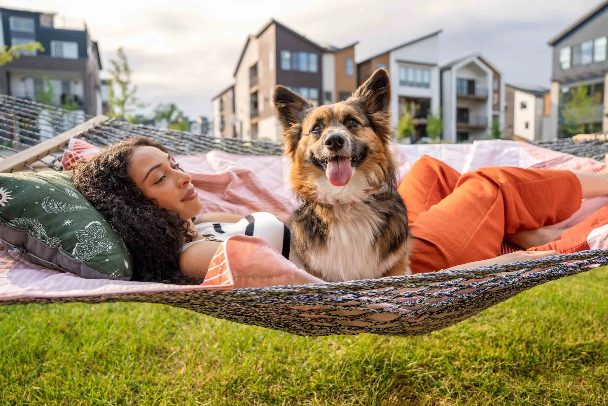 Woman-Relaxing-in-a-Hammock-with-Dog.jpg