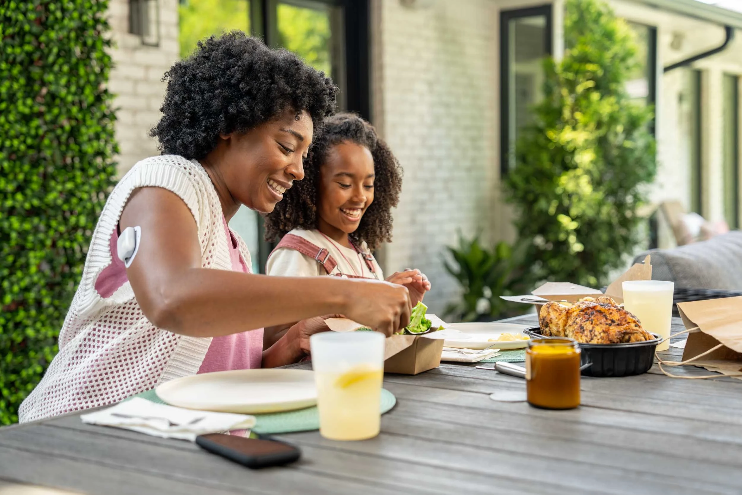 Woman-and-Girl-Eating-on-Patio.jpg