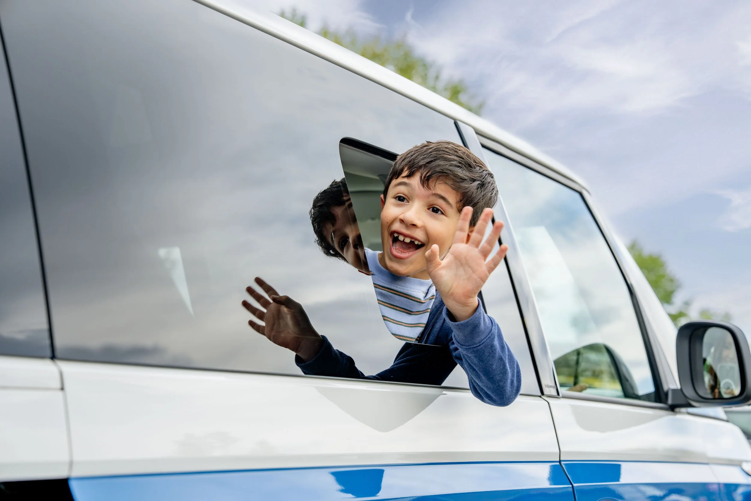 Child-Waving-from-Volkswagen-ID-Buzz-Window.jpg