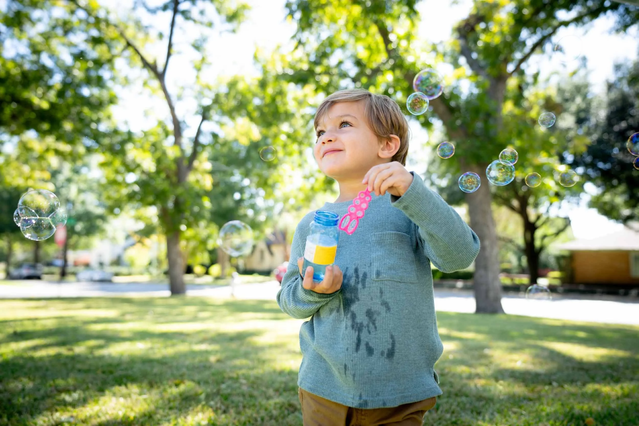 Child-Blowing-Bubbles-Outside.jpg