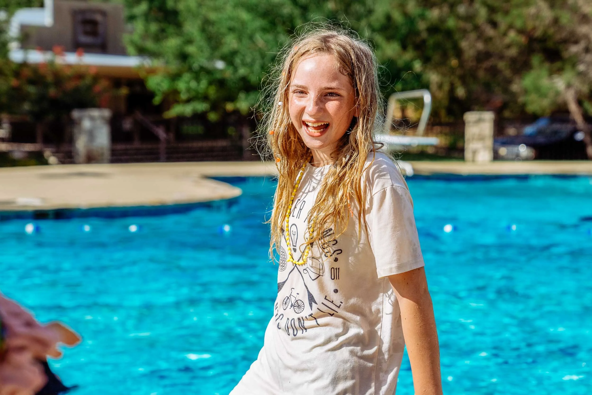 Girl-Laughinh-by-Swimming-Pool.jpg