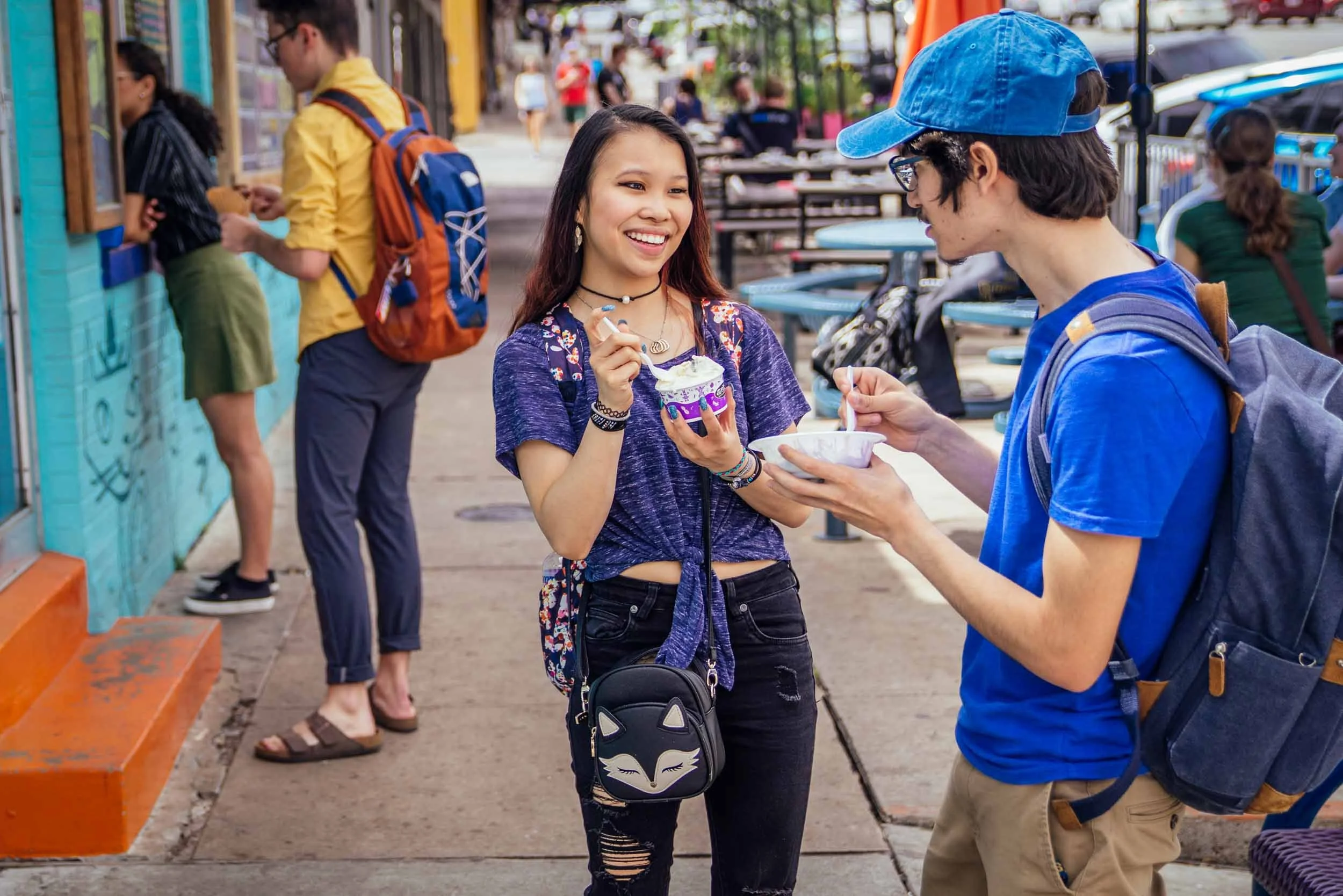 Friends-Enjoying-Ice-Cream-Outside-Shop.jpg