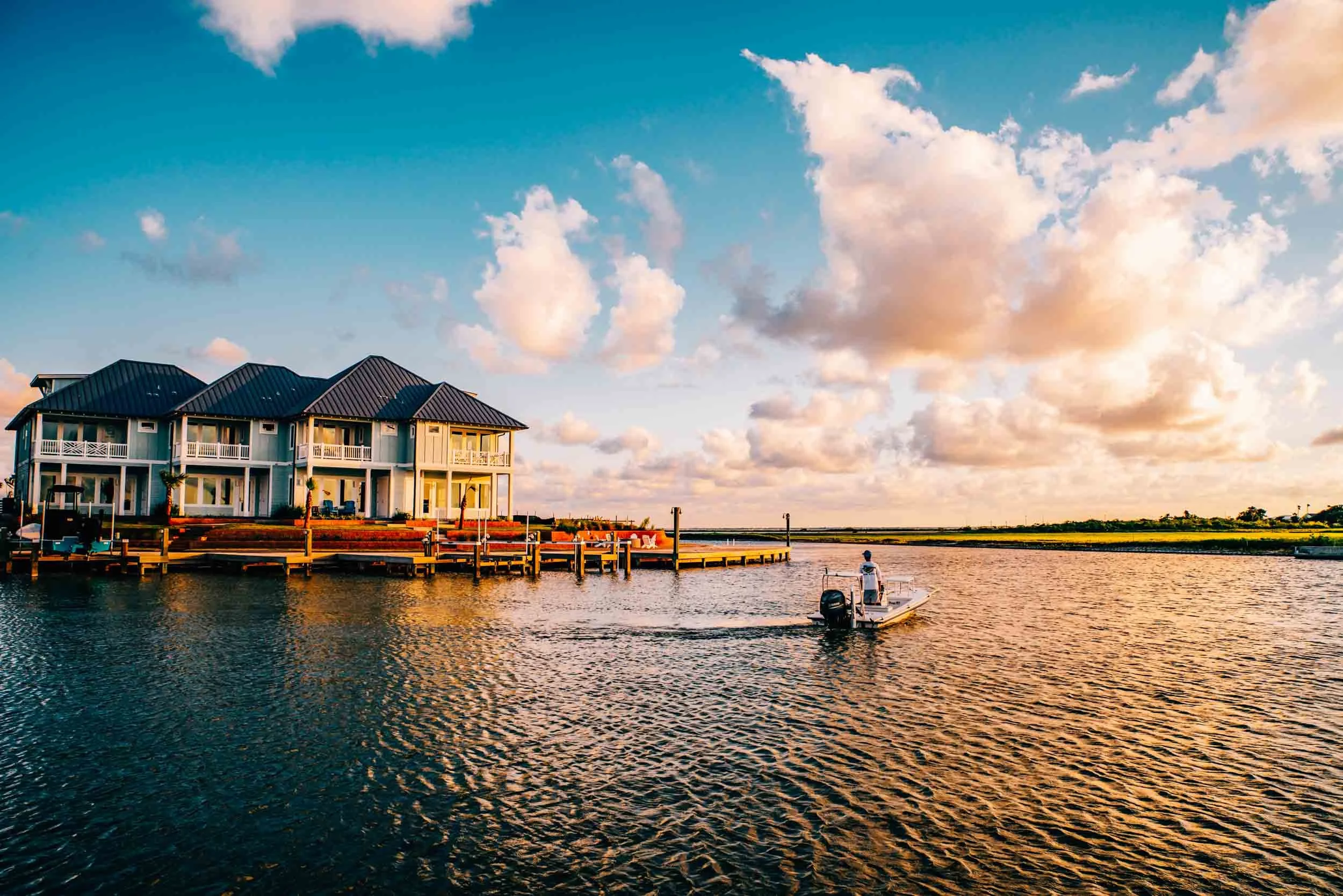 Boat-and-homes-at-sunset.jpg