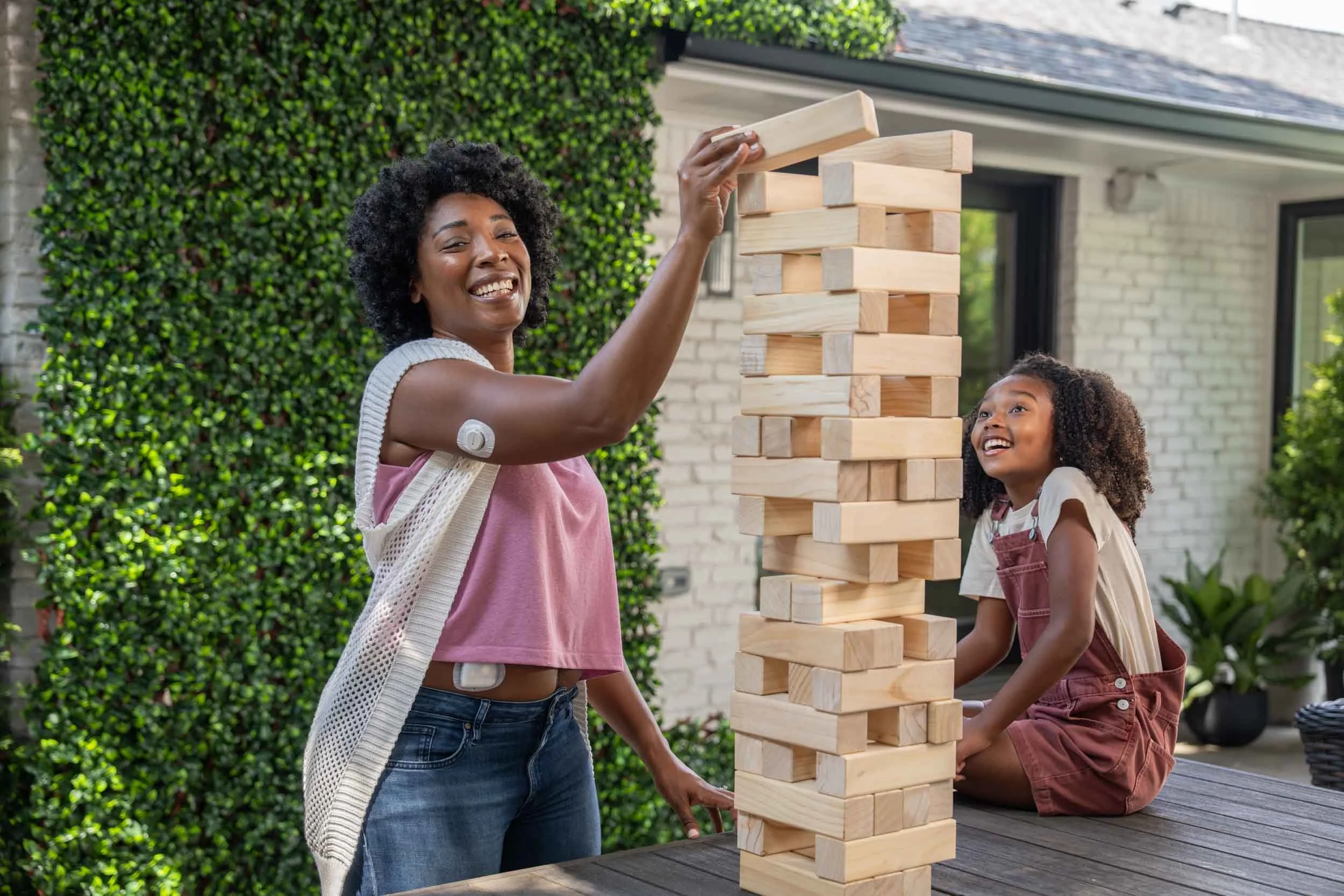 Woman-and-Girl-Playing-Jenga-on-Patio.jpg