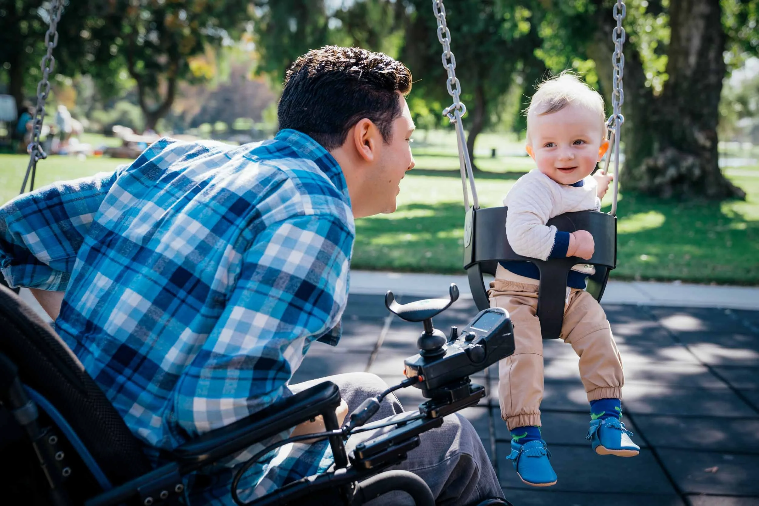 Man-in-Wheelchair-Pushing-Baby-in-Swing.jpg